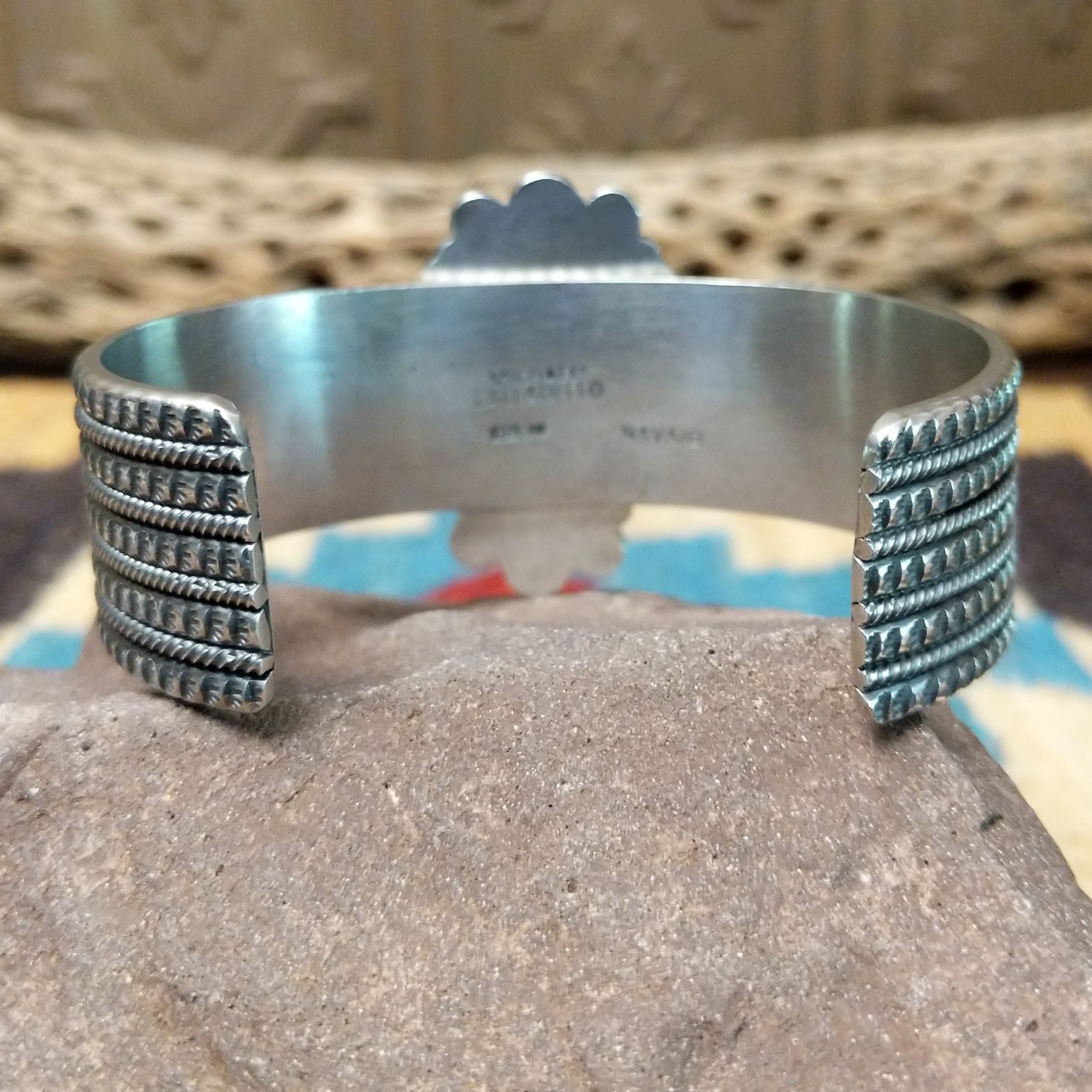 Kingman turquoise cuff by Michael Calladitto, featuring a blue Kingman turquoise stone with a natural brown matrix set in a handcrafted sterling silver cuff; underside view.