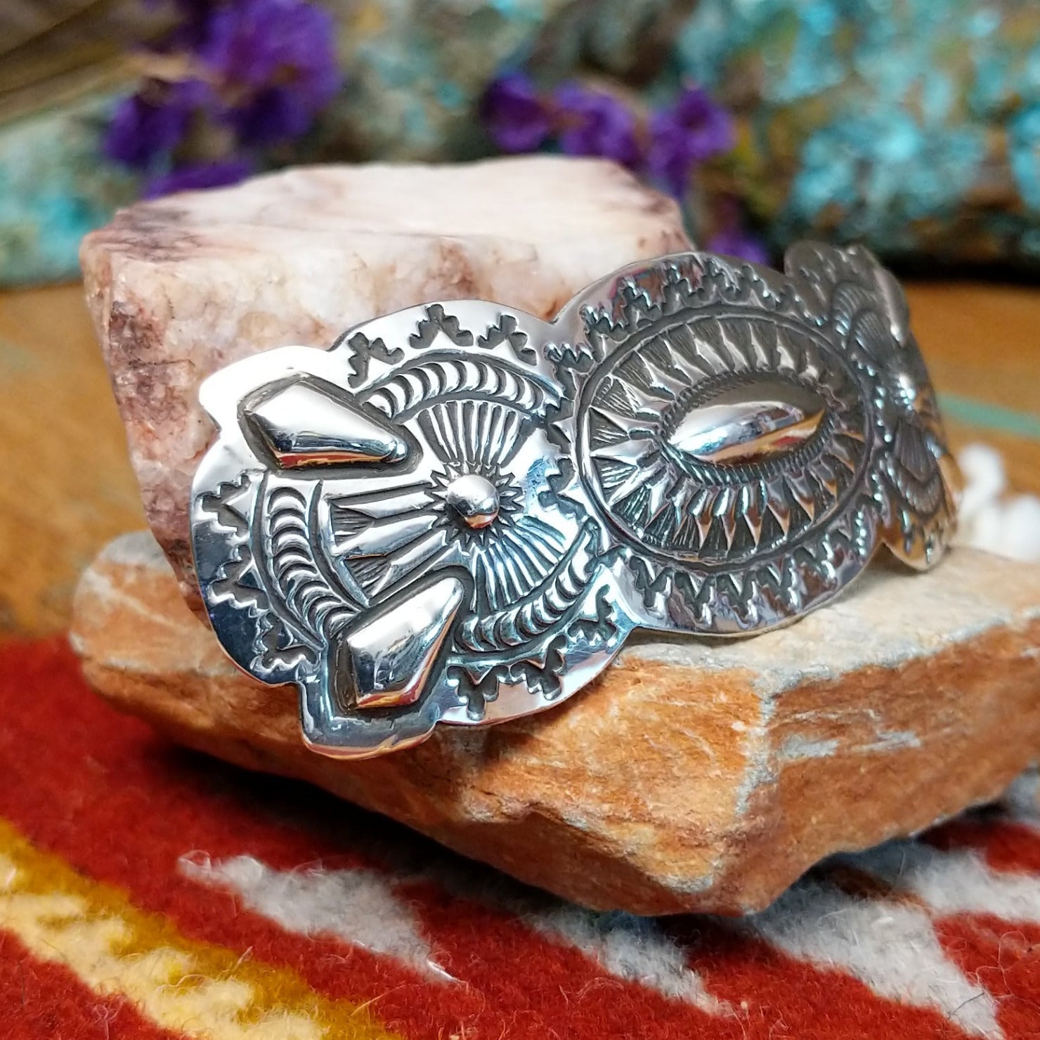 Sterling silver barrette by Harold Tom with ornate stamped silverwork and raised oval center.