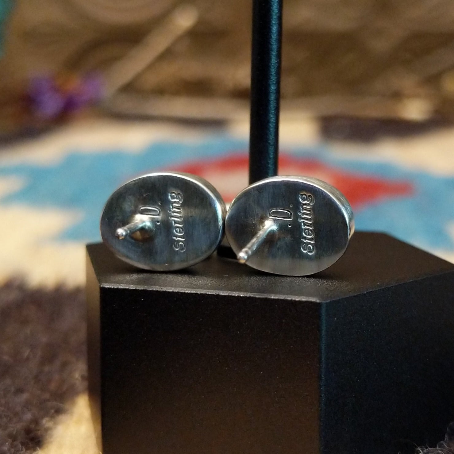 Close-up of the artisan's stamped signature.