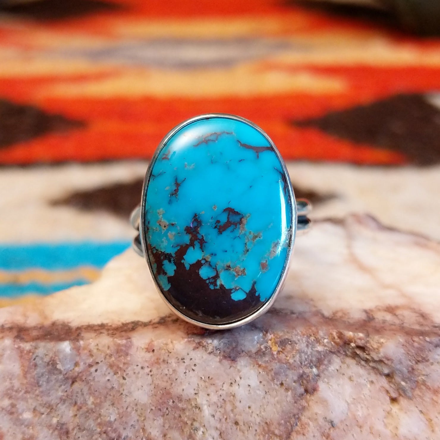 Sterling silver ring with Kingman turquoise set in the large, oval bezel.