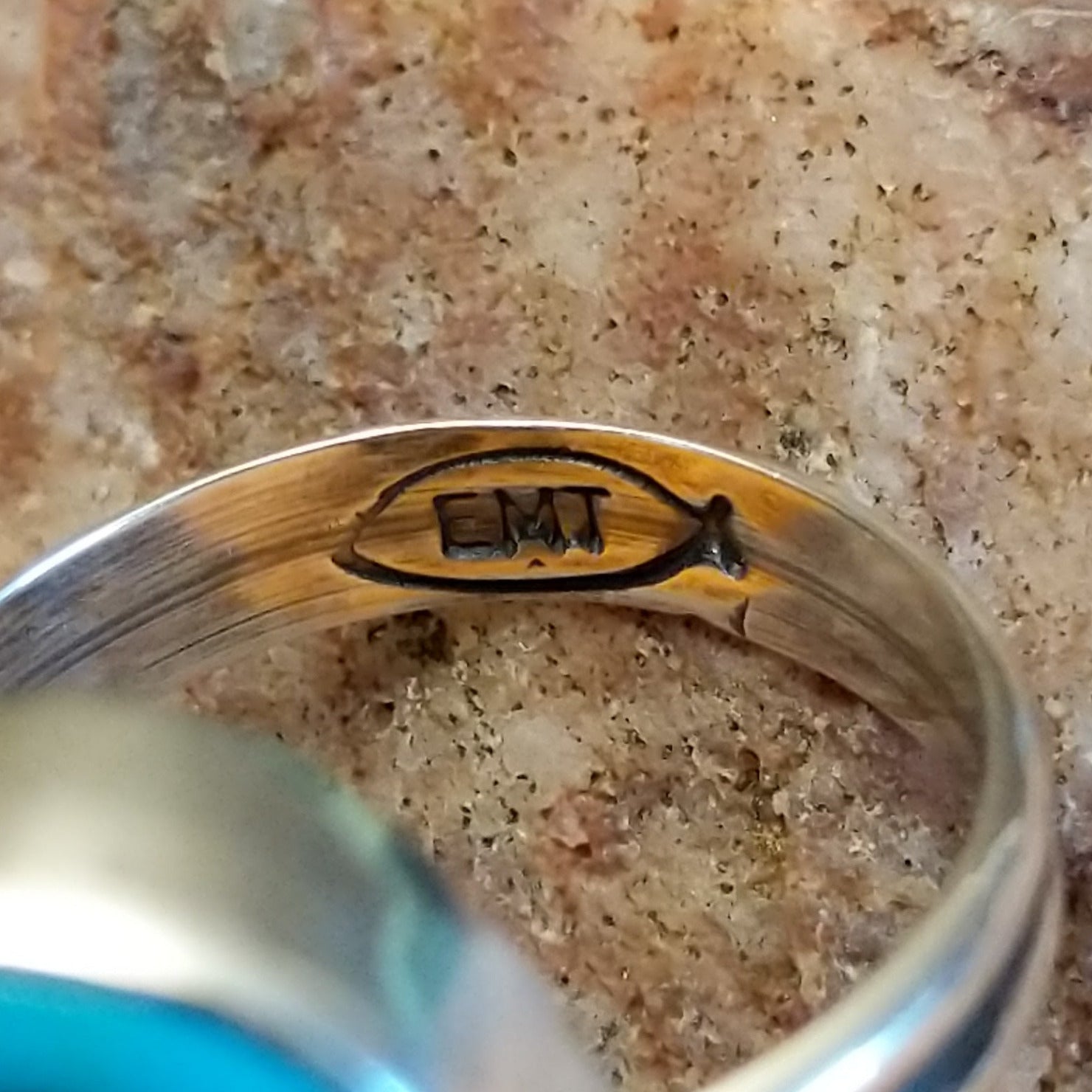 Close-up of the artisans' stamped signature.