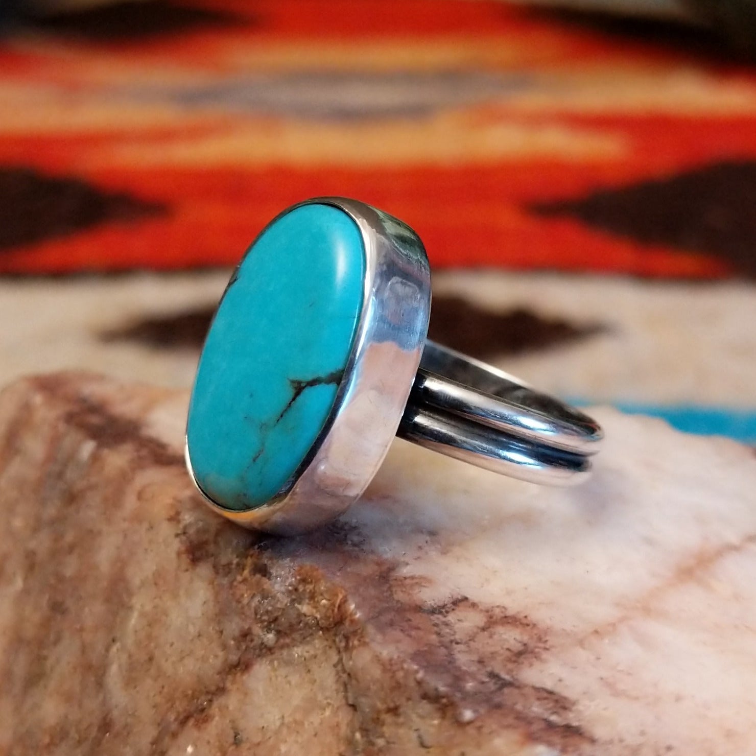 Sterling silver ring with Kingman turquoise set in the large oval bezel.