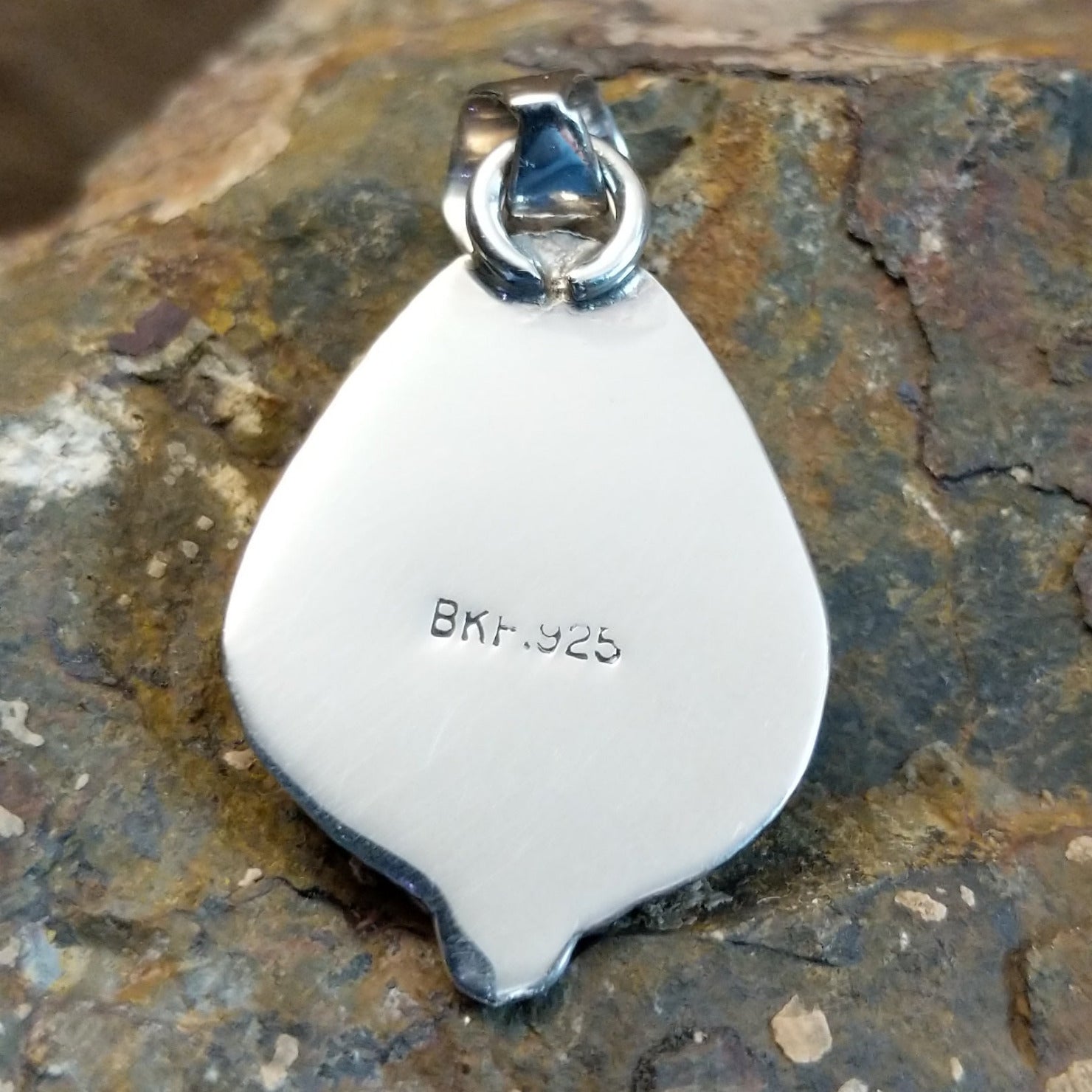 Artisan and Sterling Silver stamp on back.