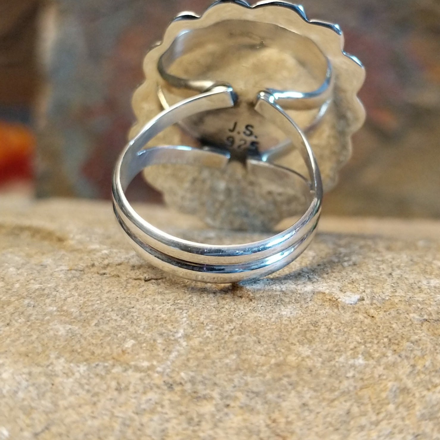 Artisan and Sterling Silver stamp.