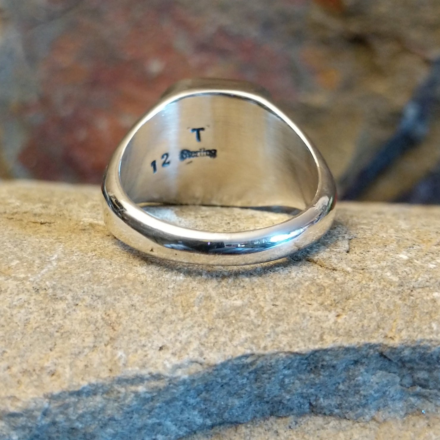 Artisan and Sterling Silver stamp.