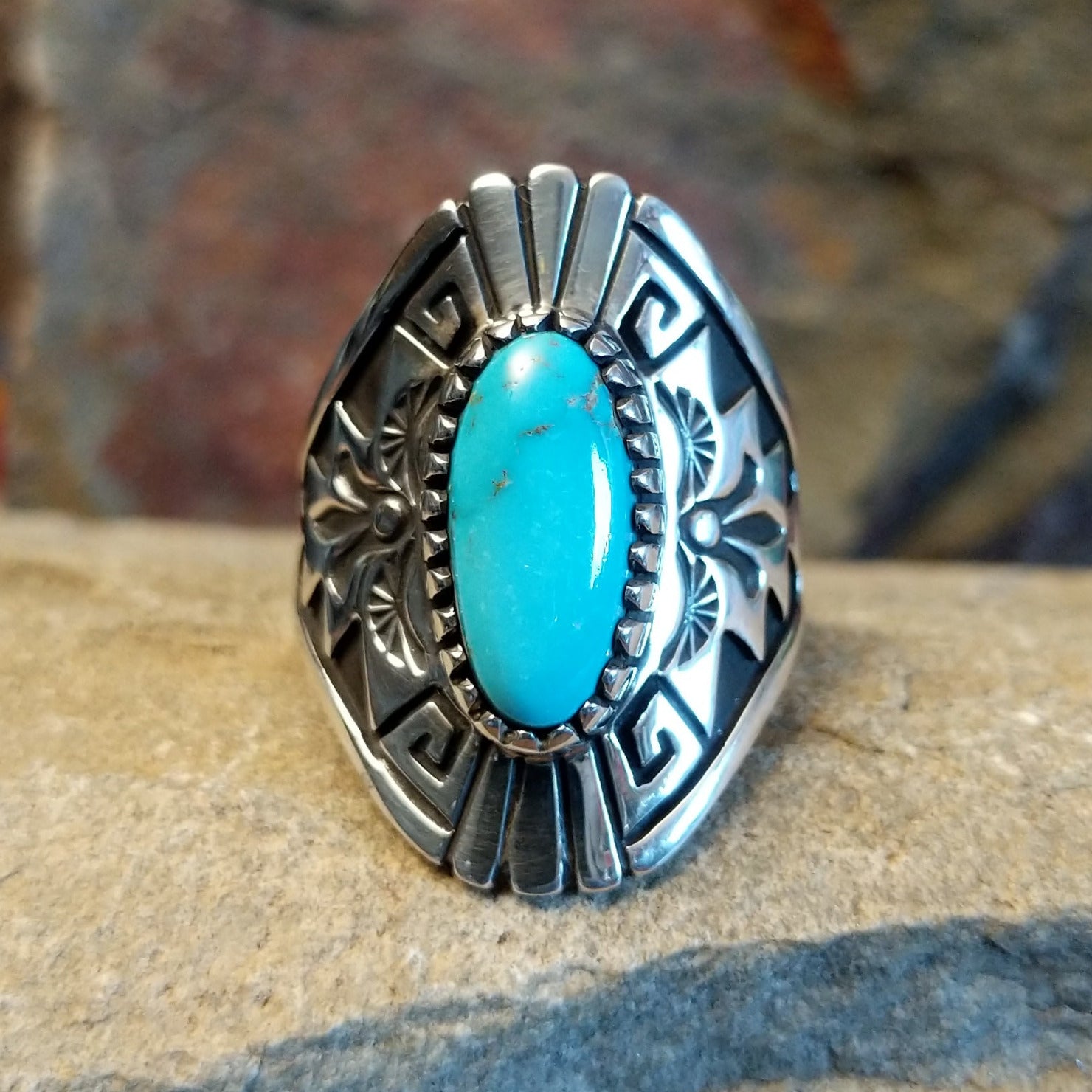Stamped Sterling silver turquoise ring by Fred Charley; size 12.