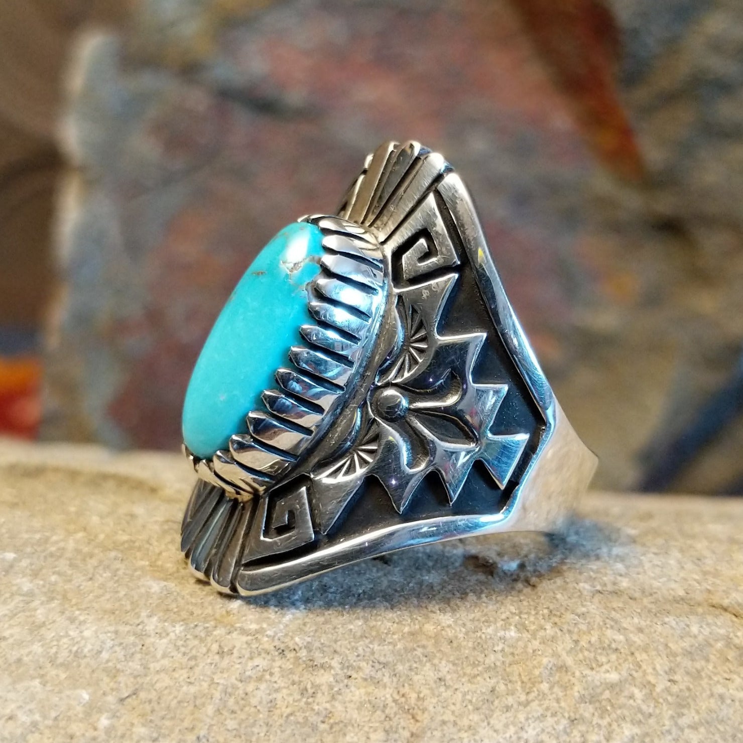 Stamped Sterling silver turquoise ring by Fred Charley; size 12 side view.