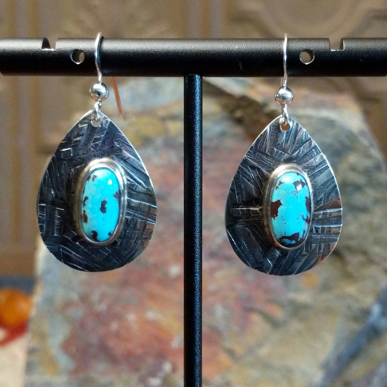 Kingman turquoise earrings by Navajo artists Everett & Mary Teller in planished sterling silver.