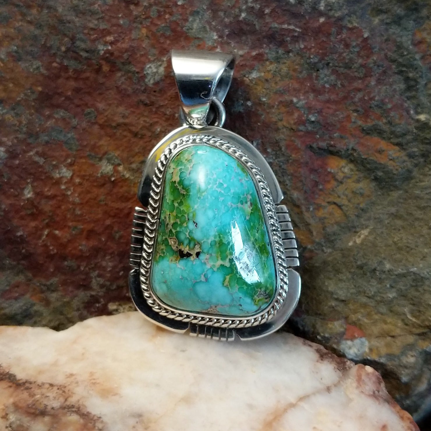 Sonoran Gold turquoise pendant by Navajo artist Burt Francisco, handcrafted in sterling silver with an etched setting.