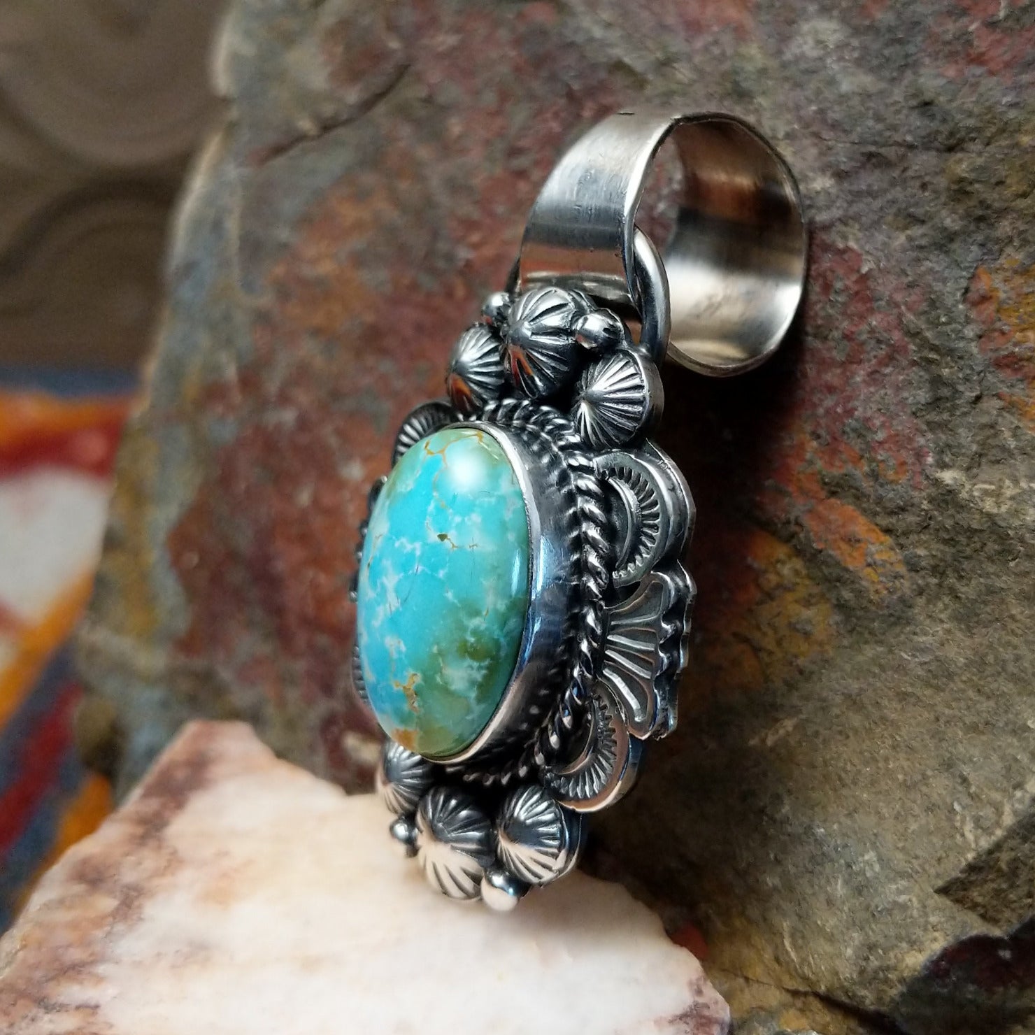Sonoran Gold turquoise pendant by Navajo artist Rosita Calladitto, handcrafted in sterling silver, side view.