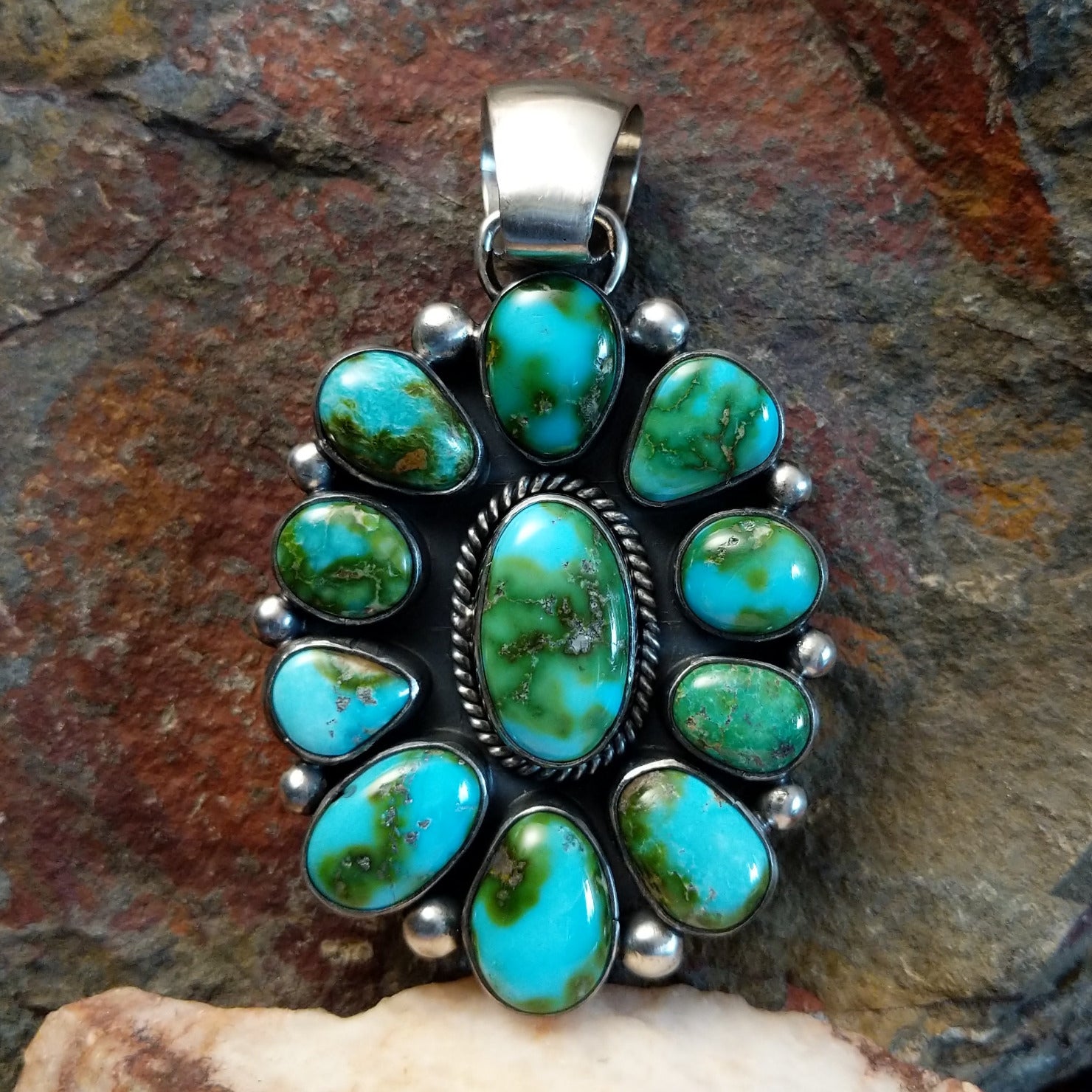Multi-stone Sonoran Gold turquoise pendant by Navajo artist Angela Martin, handcrafted in sterling silver.
