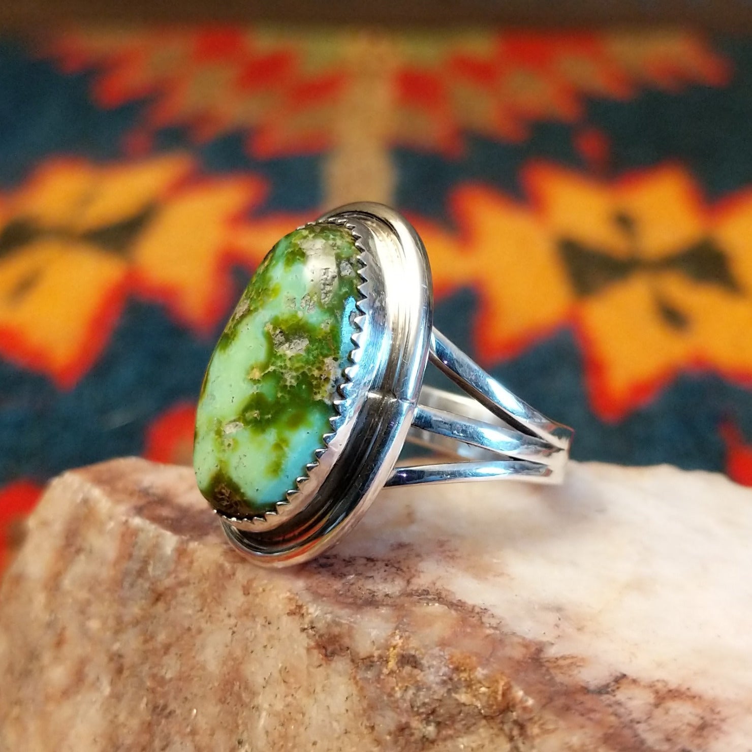 Sonoran Gold Turquoise oval stone set in sterling silver by artist Roie Jaque, Size 6 side view.