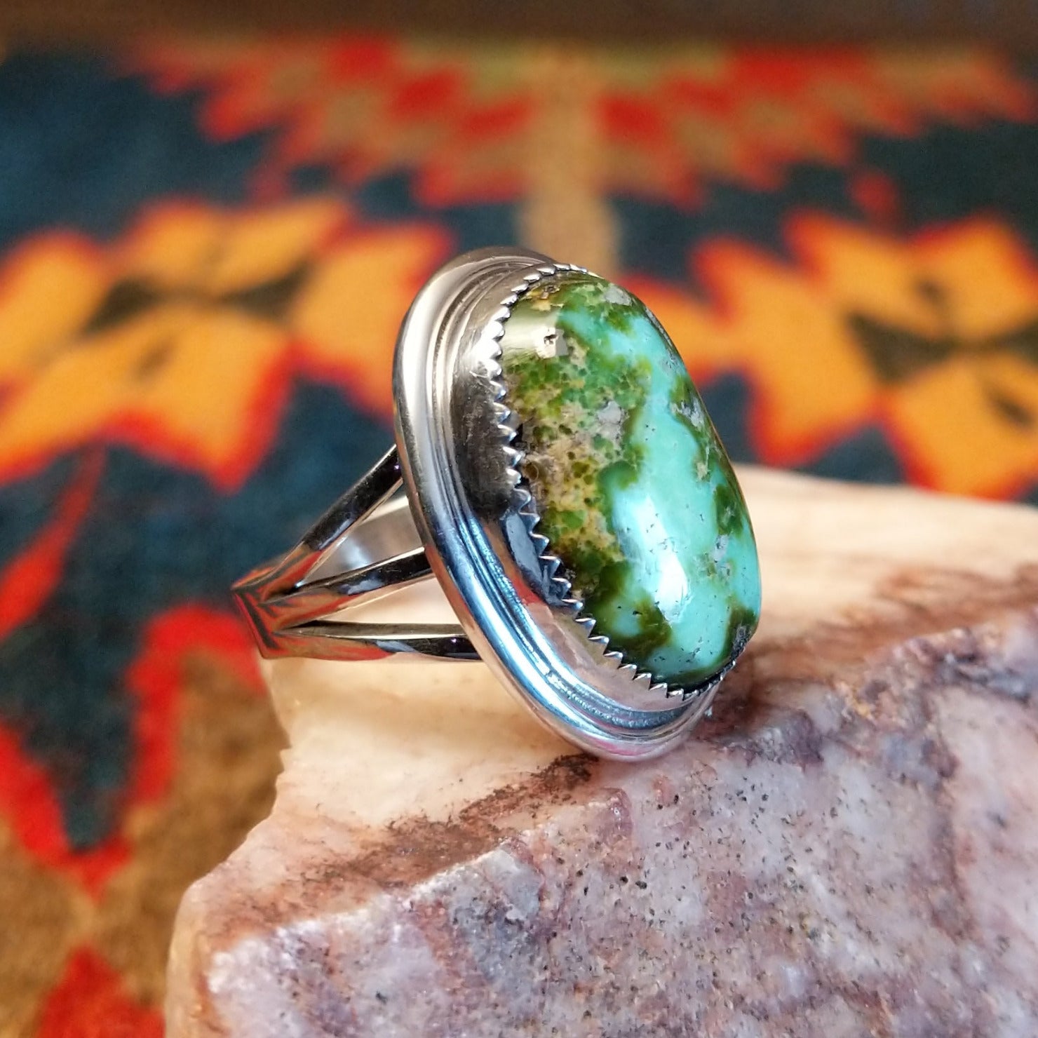 Sonoran Gold Turquoise oval stone set in sterling silver by artist Roie Jaque, Size 6 side view.