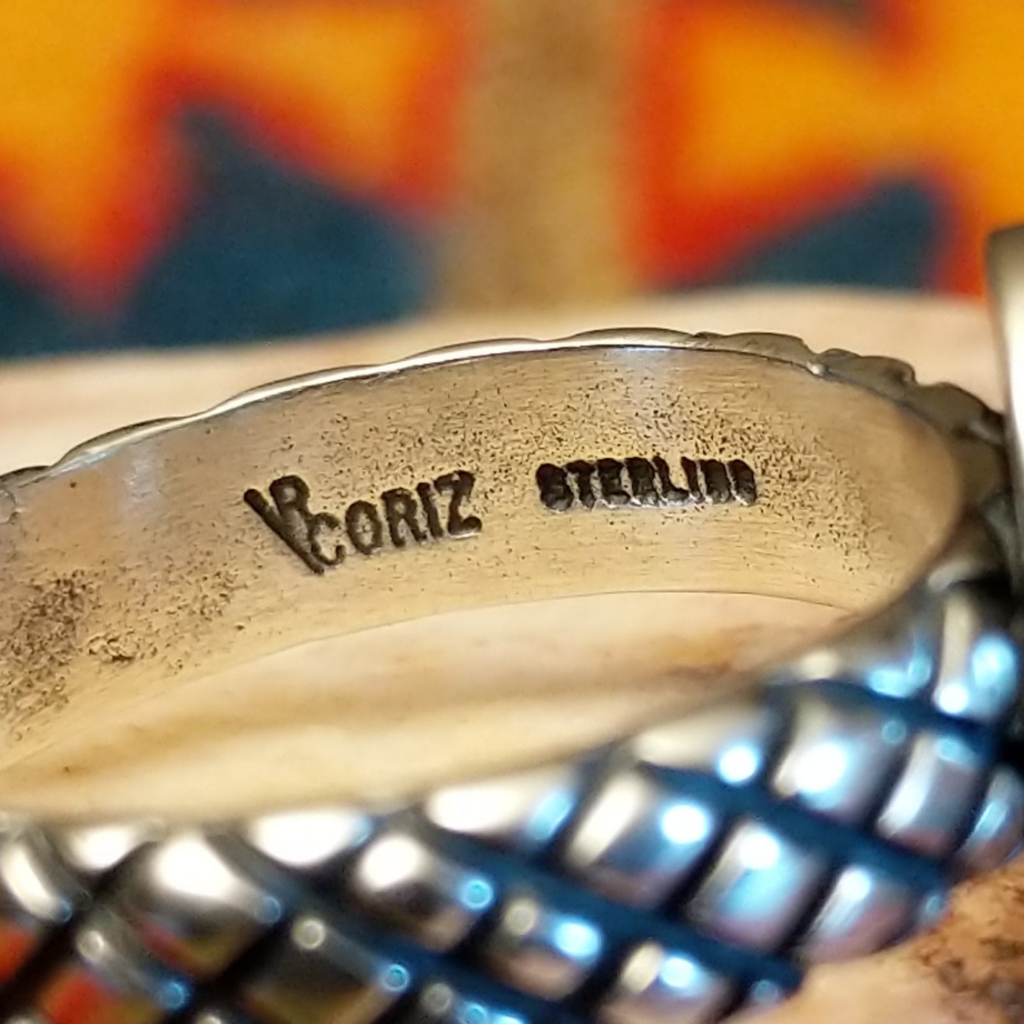 Artisan and Sterling Silver Stamp on the inside of band.