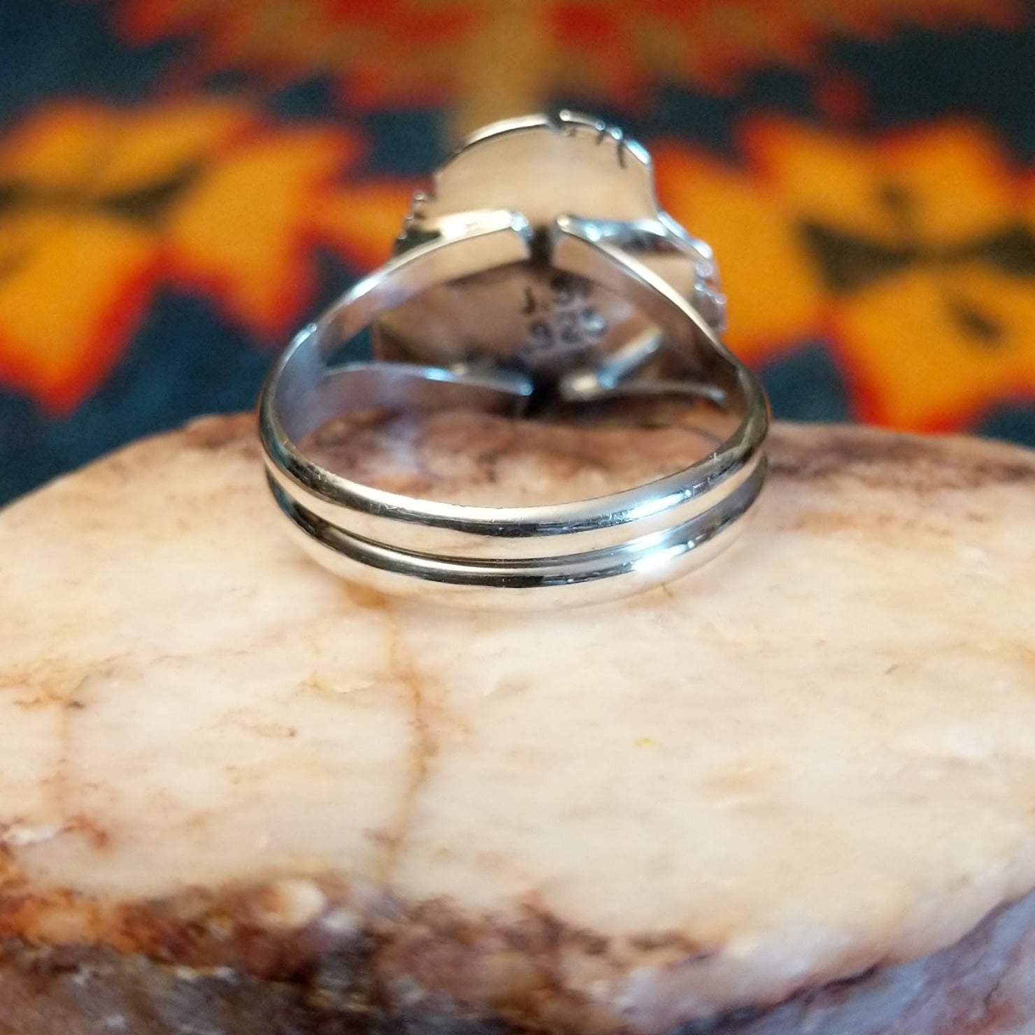 Artisan and Sterling Silver stamp on underside of ring.