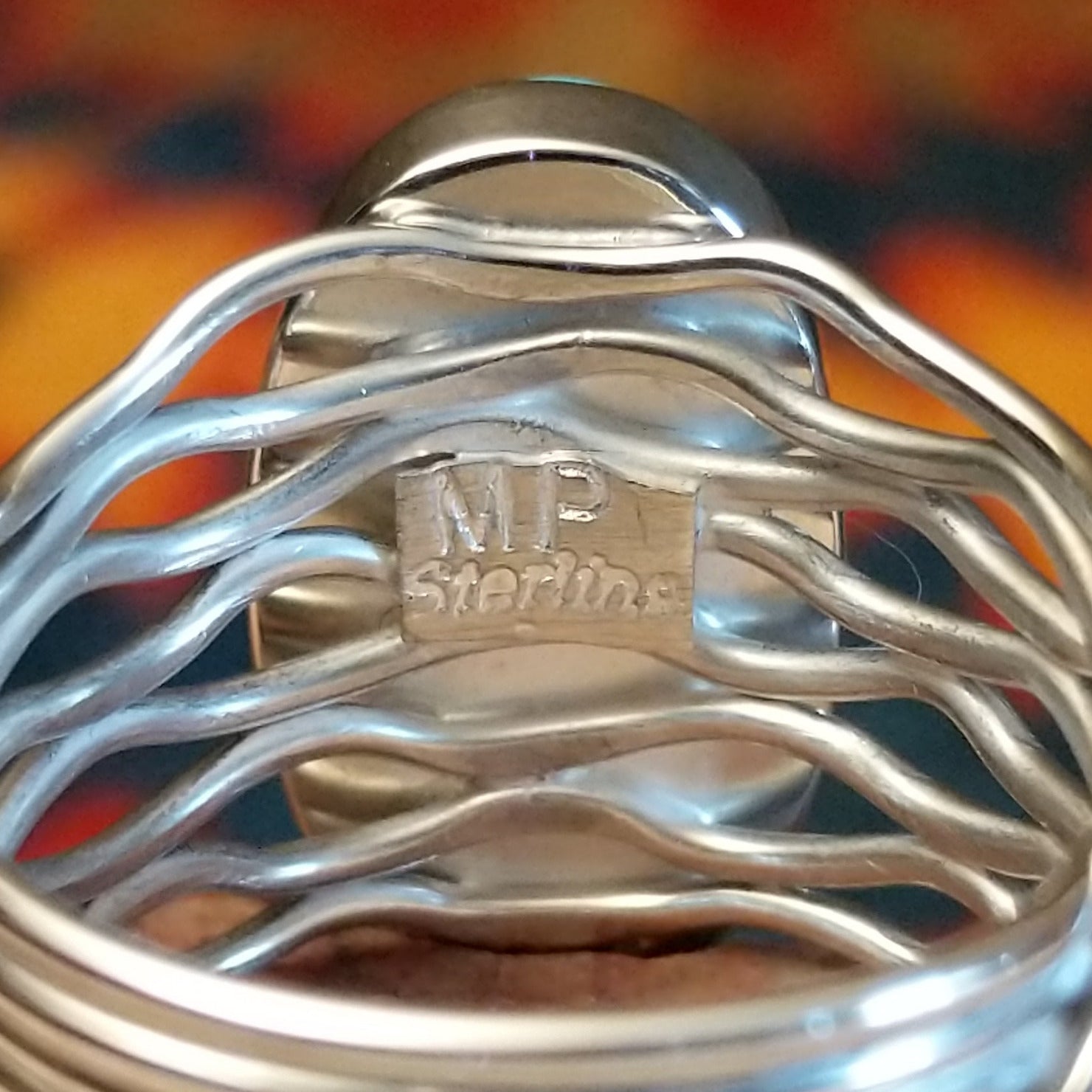 Artisan and Sterling stamp on underside of ring.