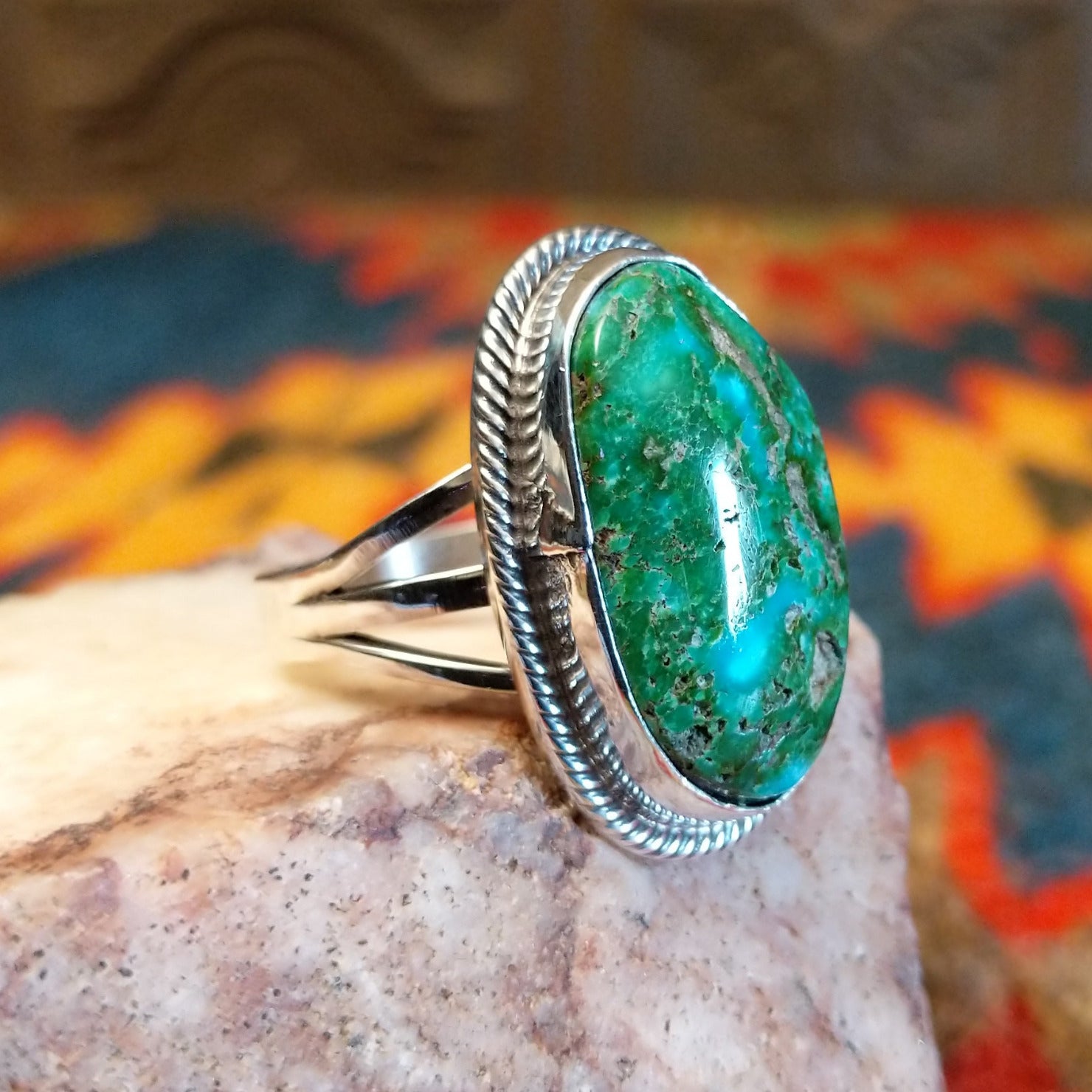 Sonoran Gold Turquoise stone set in a classic trifurcate sterling silver band. Made by Roie Jaque, this ring is size 10, side view.