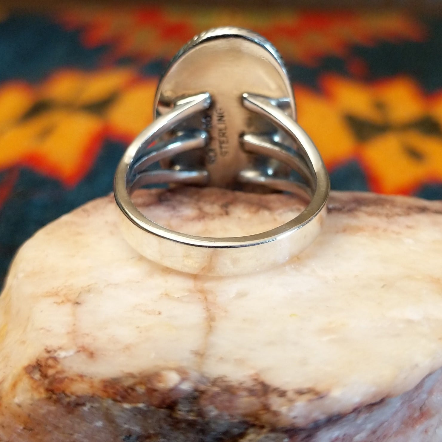 Artisan and Sterling Silver stamp on underside of ring.