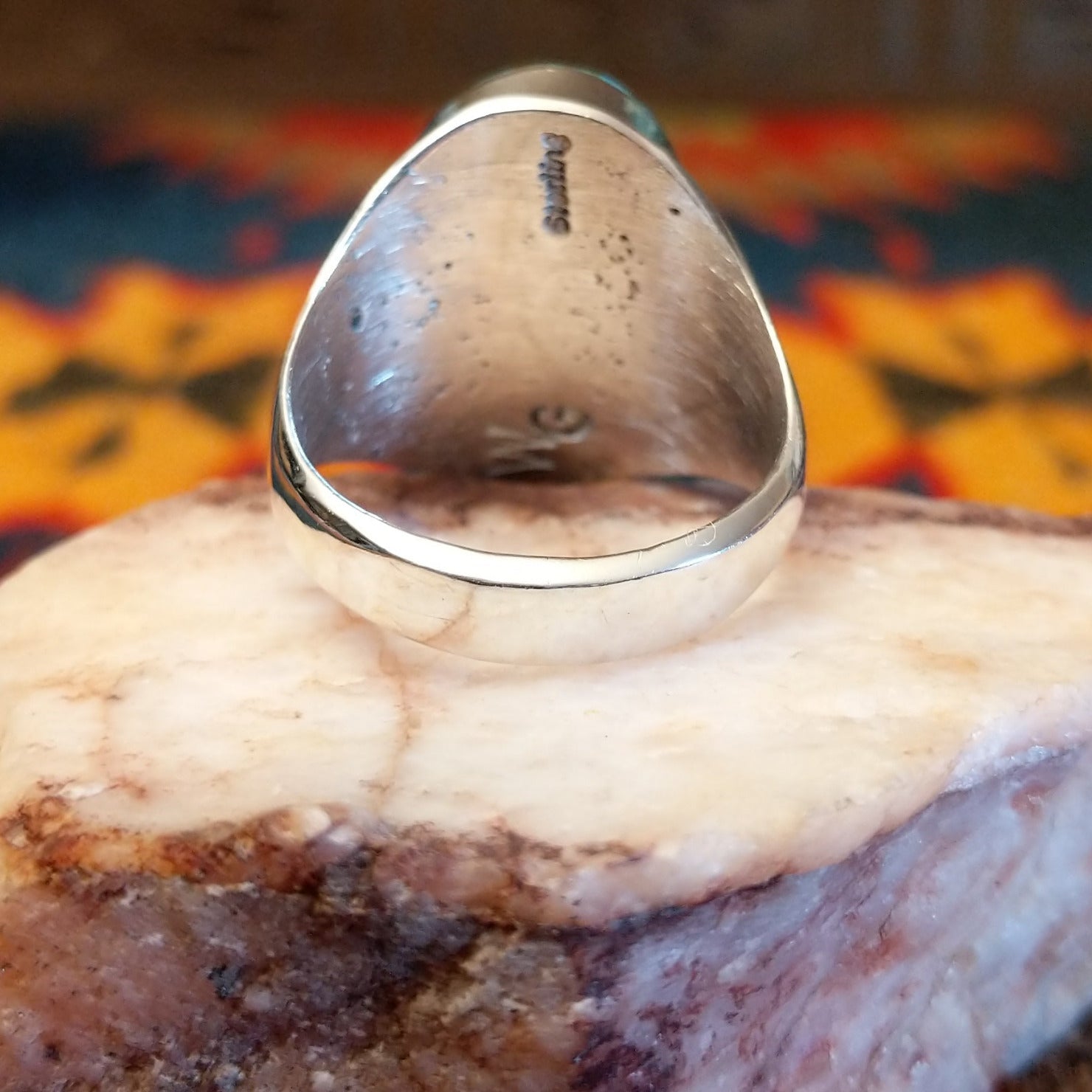Artisan and Sterling Silver stamp on underside of ring.
