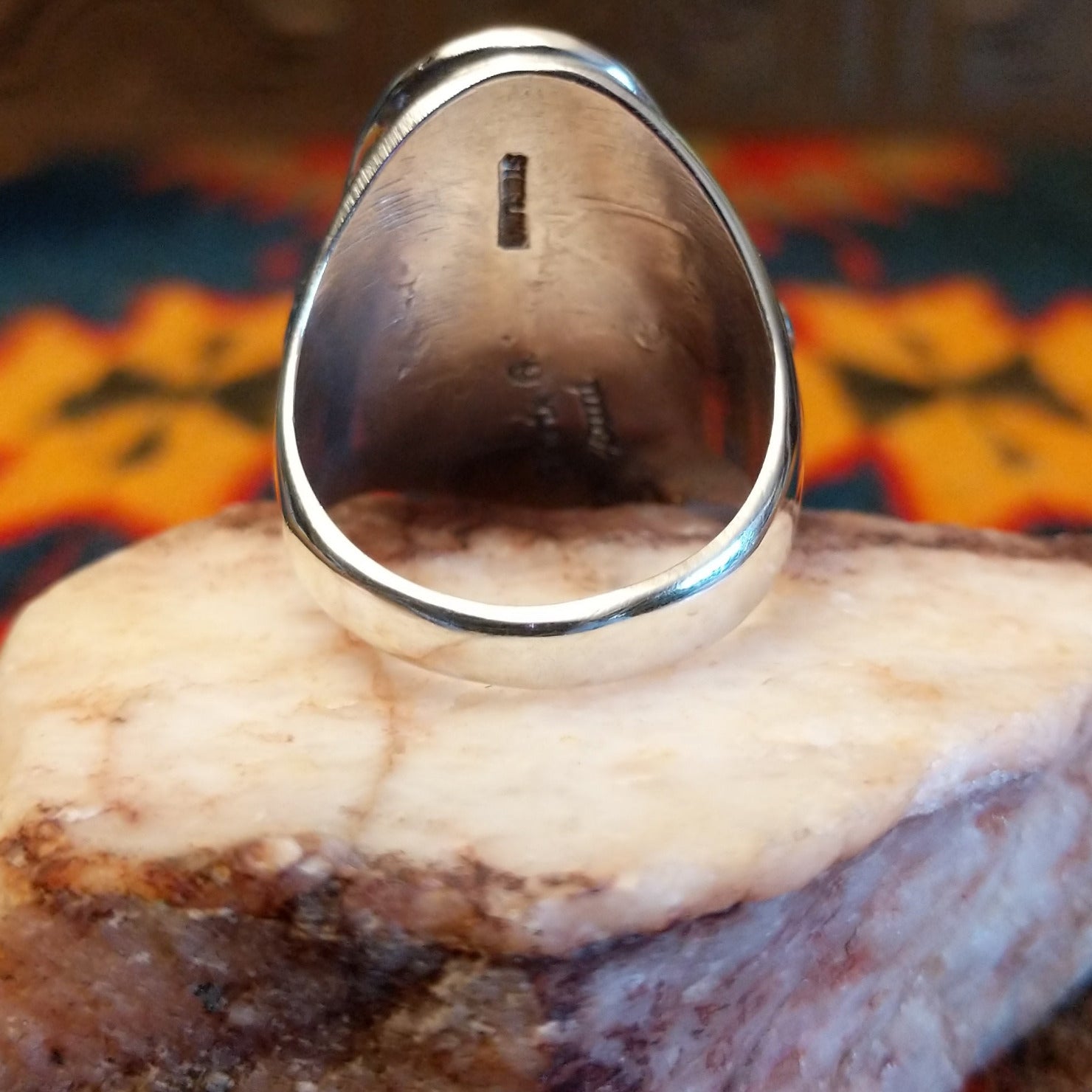 Artisan and Sterling Silver stamp on underside of ring.