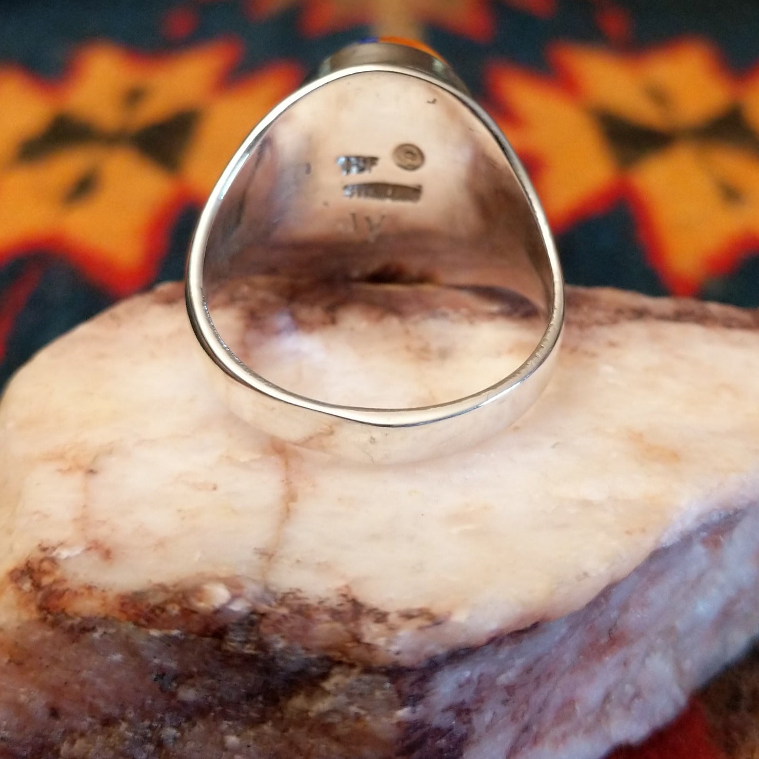 Artisan and Sterling Silver stamp on underside of ring.