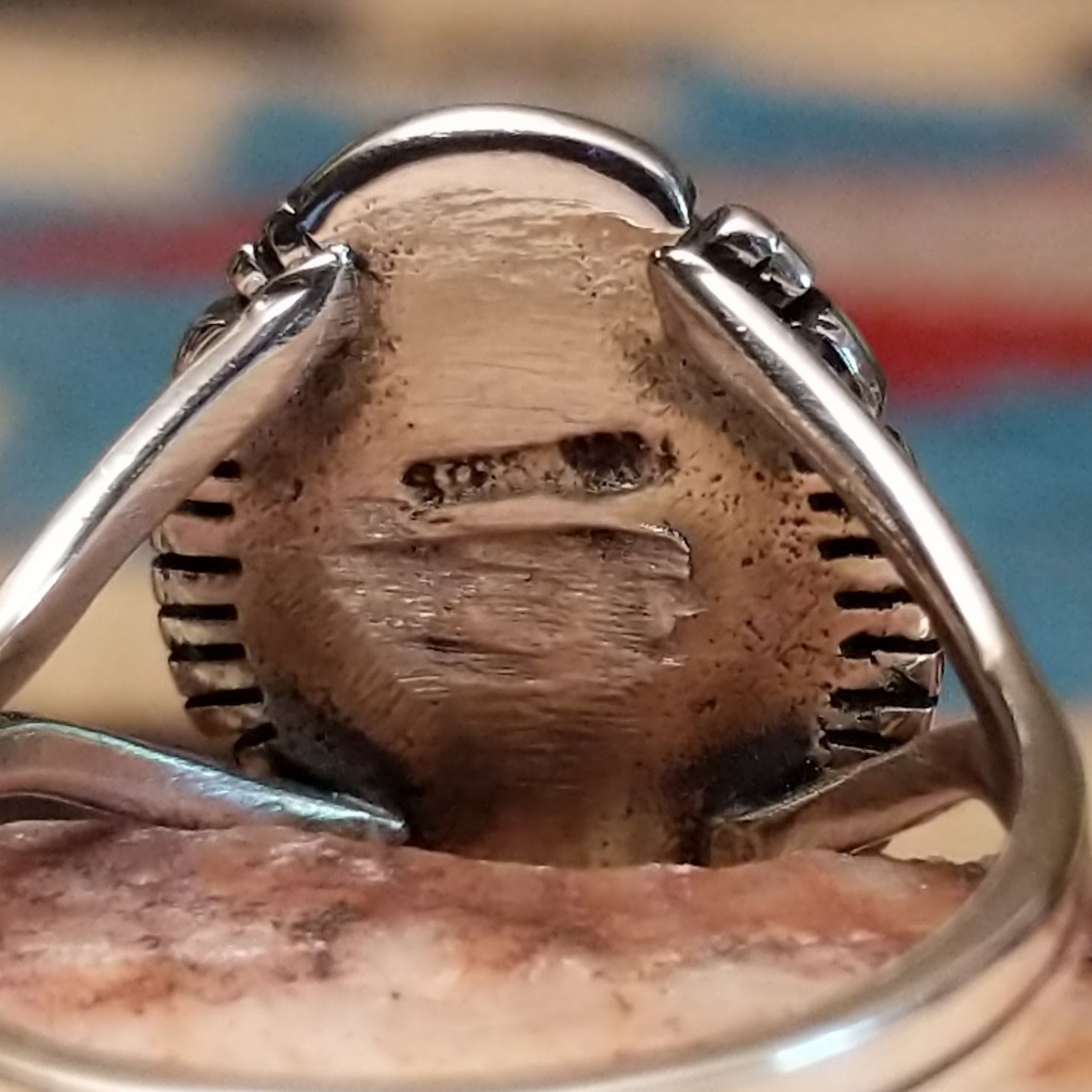 Navajo sterling silver ring with an oval Bumblebee Jasper stone featuring bold yellow, orange, black, and cream natural patterns. Artisan and silver stamp.