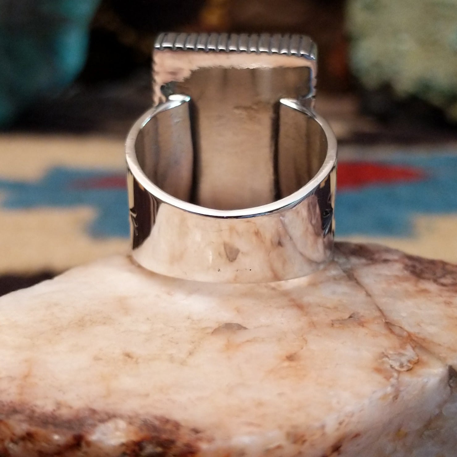 Sterling silver rectangular turquoise ring by Joe Paul featuring a vivid blue turquoise stone in a bold Southwestern design. Underside view.