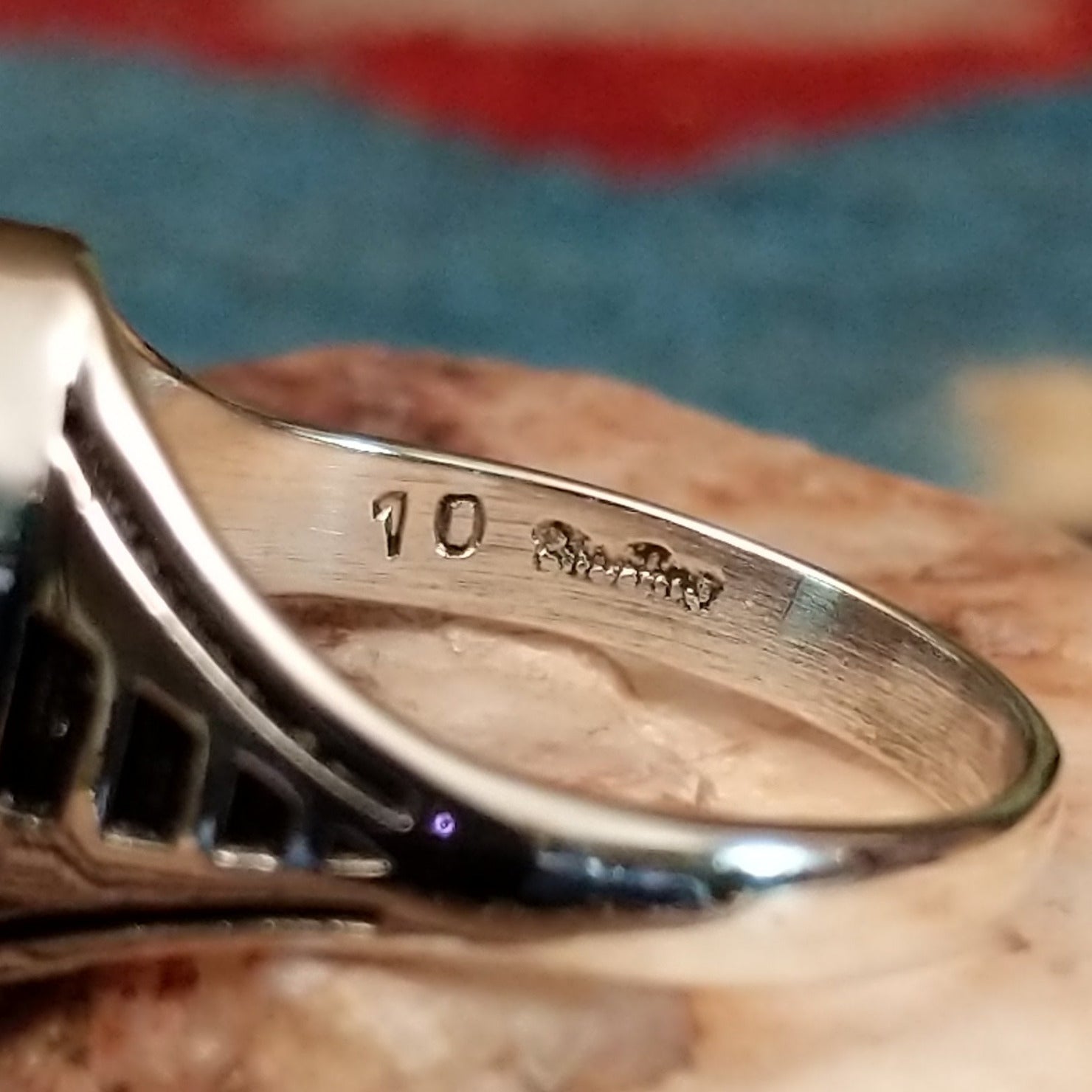 Navajo sterling silver ring with an oval Wild Horse stone featuring natural white and brown patterns in a classic Southwestern design. Artisan and silver stamp.