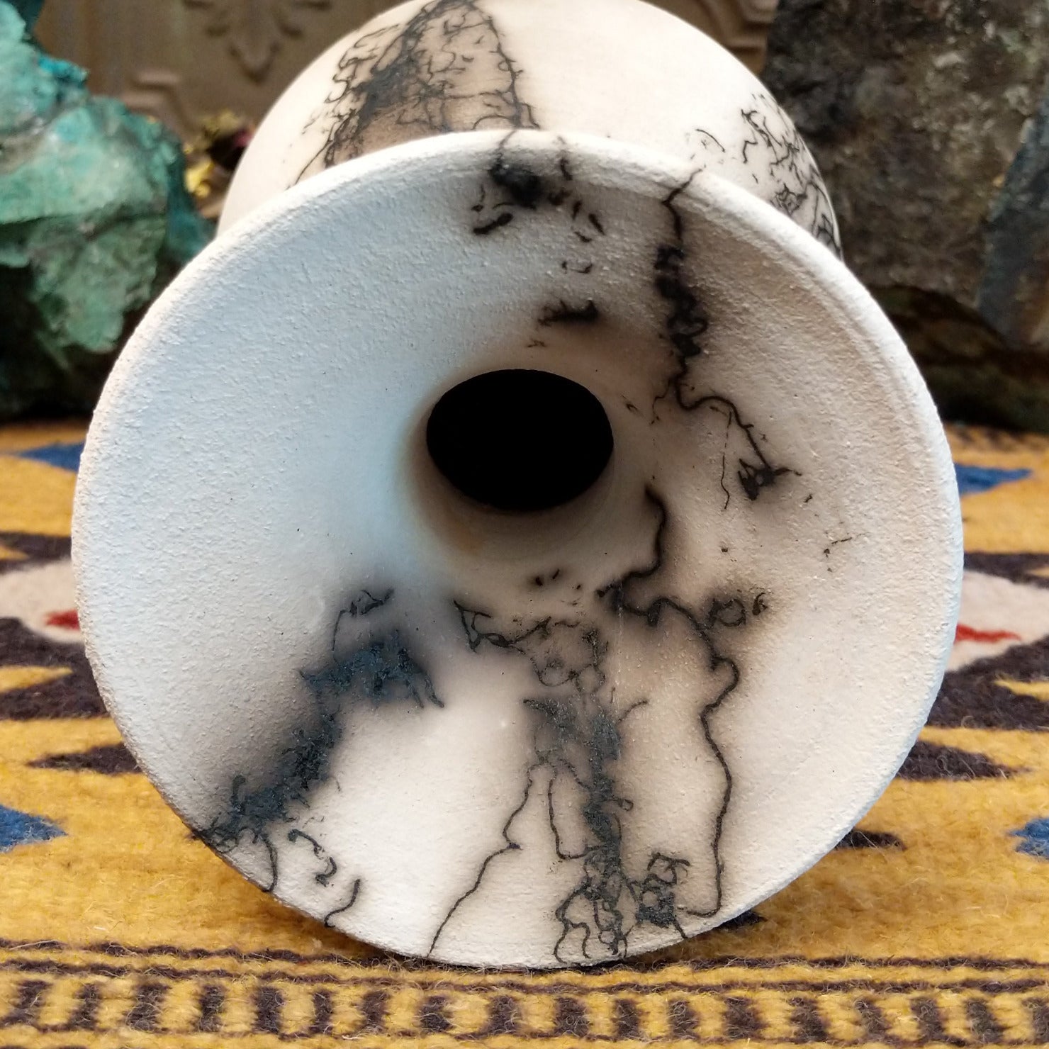 Medium flared white horsehair pottery vase by Jim Calhoun with a polished finish, smoky organic patterns, and a softly flared rim in Southwestern style. Top view.