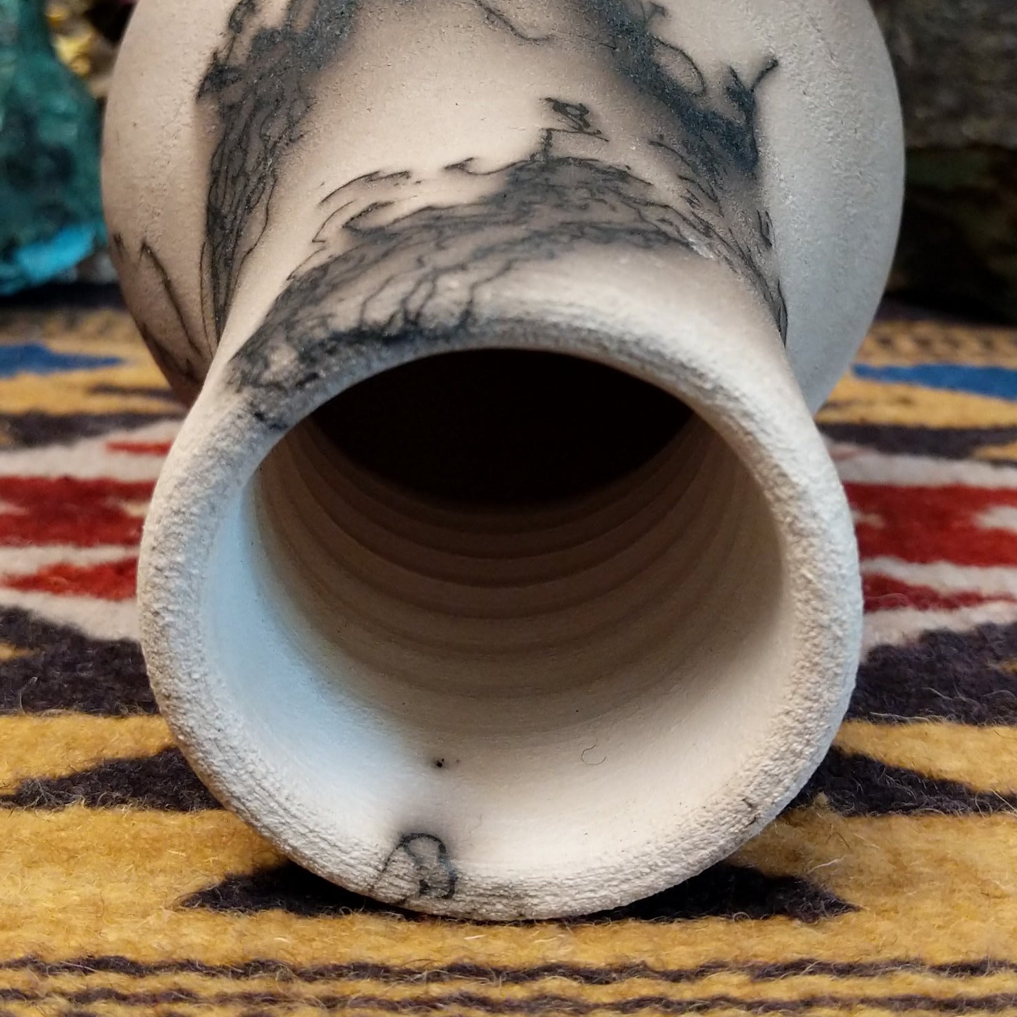 Medium-sized white horsehair chiminea-style vase by local artist Jim Calhoun with smoky natural markings, polished finish, and handcrafted Southwestern design. Top view.