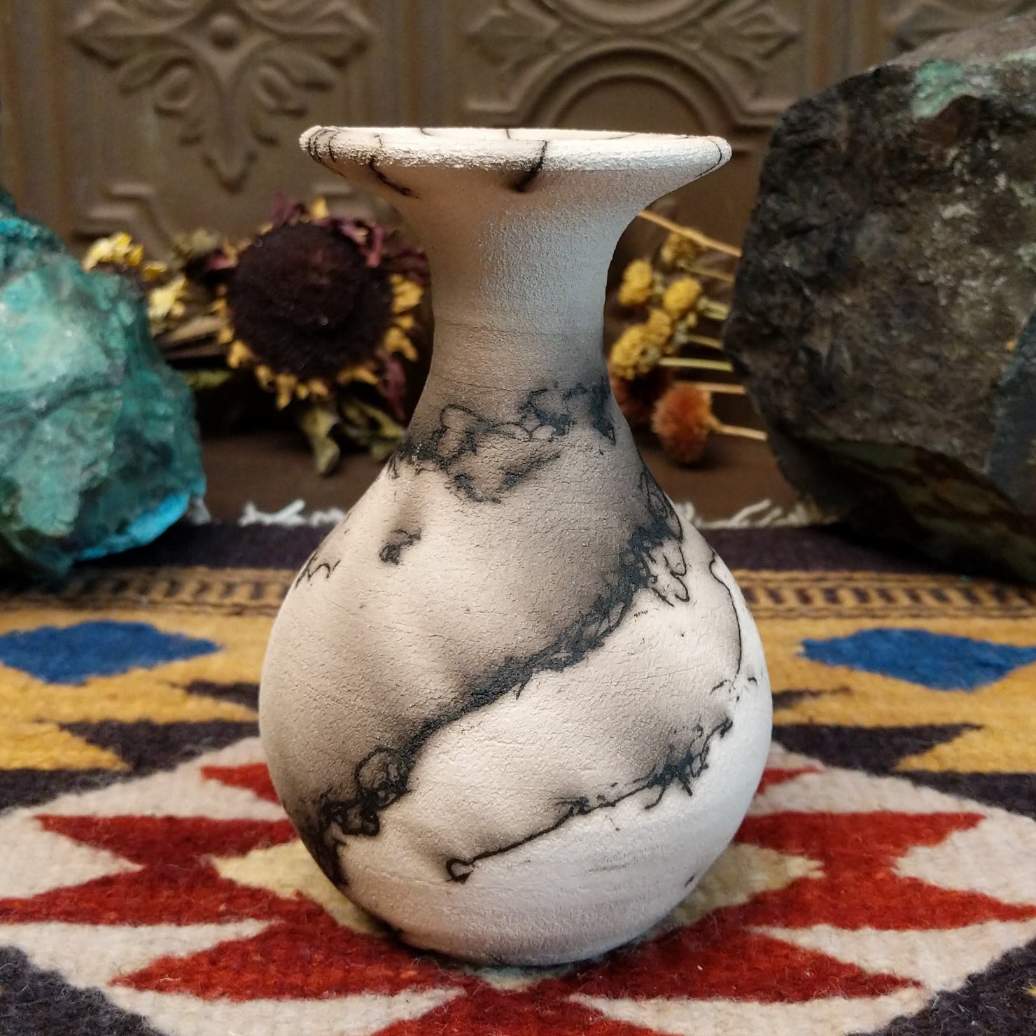 Small flared white horsehair pottery vase by local artist Jim Calhoun featuring smoky organic patterns, polished finish, and handcrafted Southwestern style.