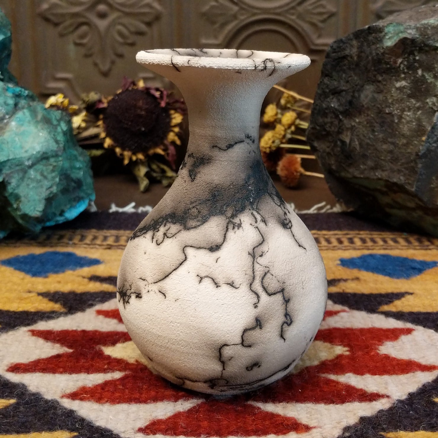 Small flared white horsehair pottery vase by local artist Jim Calhoun featuring smoky organic patterns, polished finish, and handcrafted Southwestern style.