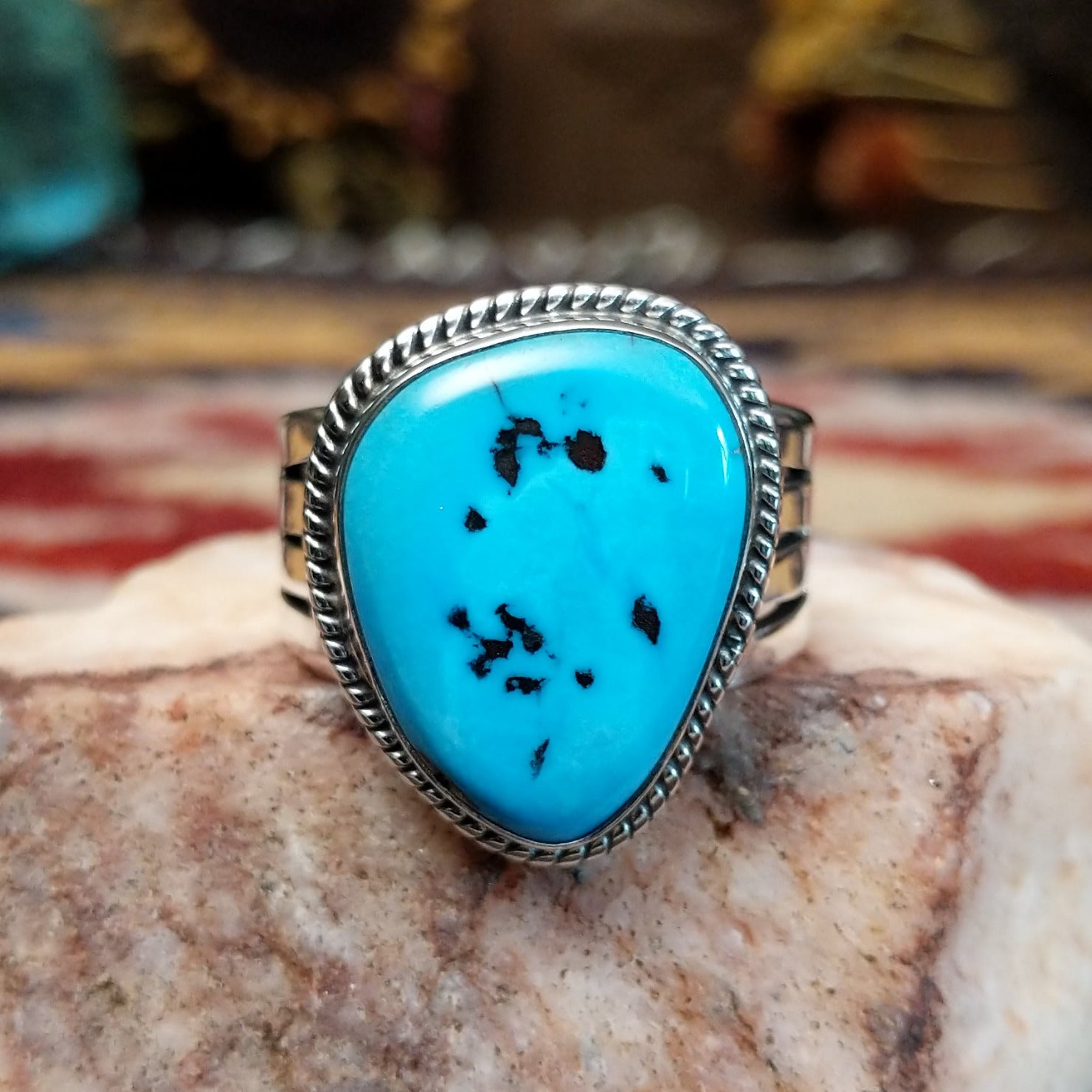 Handcrafted Navajo sterling silver ring by L.P. featuring a natural turquoise stone with traditional Southwestern silver detailing and a polished finish.