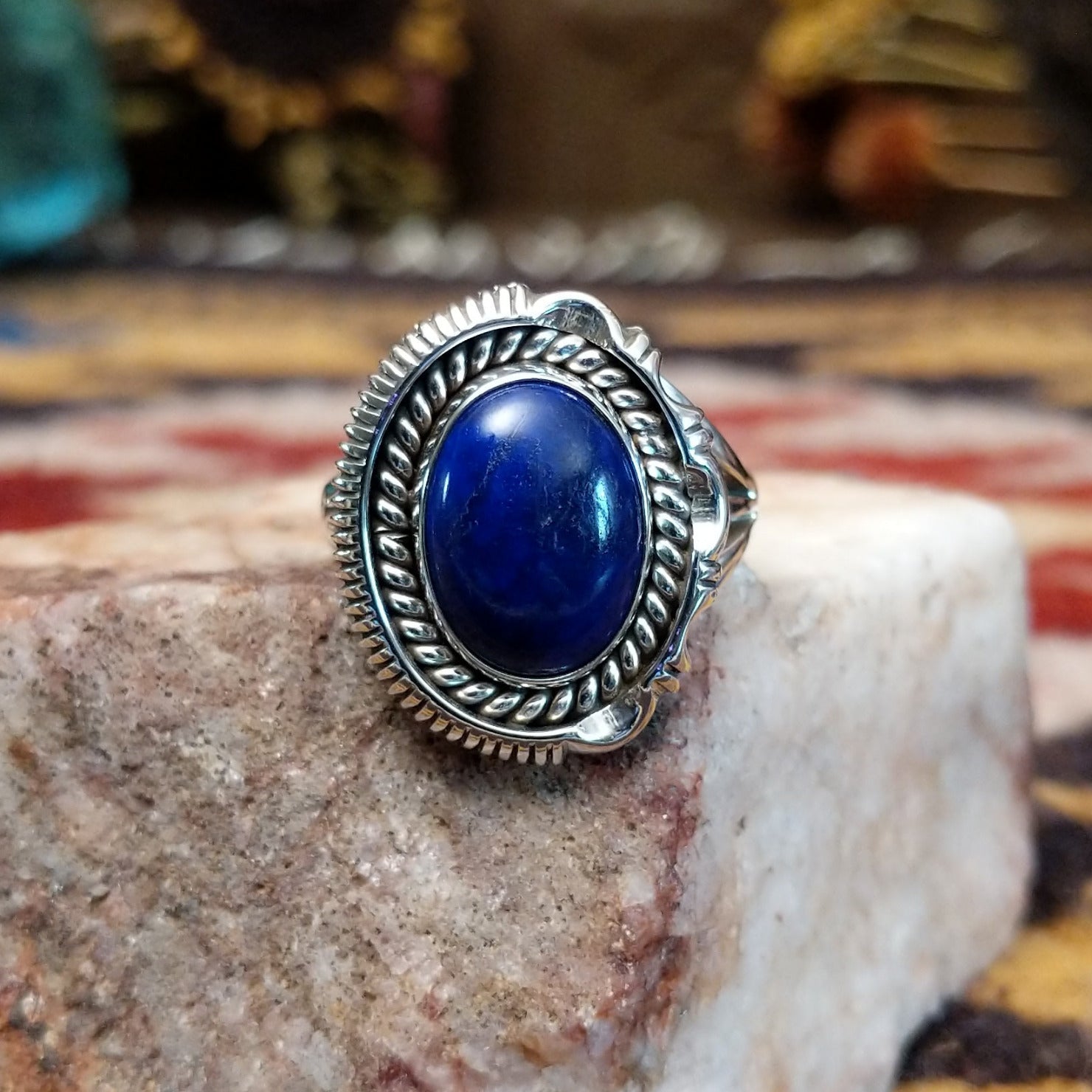 Handcrafted sterling silver oval ring by Artie Yellowhorse featuring a deep blue lapis stone in a polished Southwestern Native American design.
