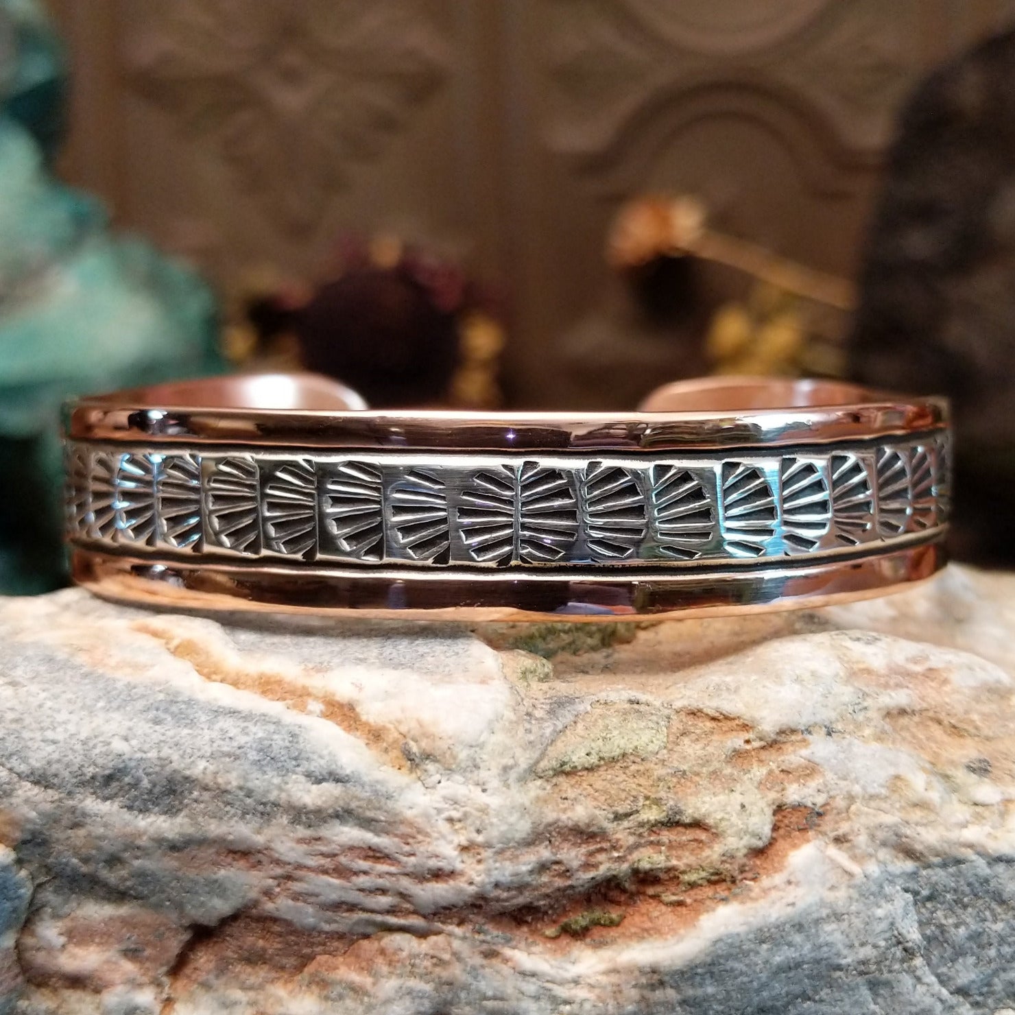 Handcrafted copper and sterling silver cuff bracelet by Navajo artisan Robert Little featuring fan-stamped detailing in a traditional Southwestern design.