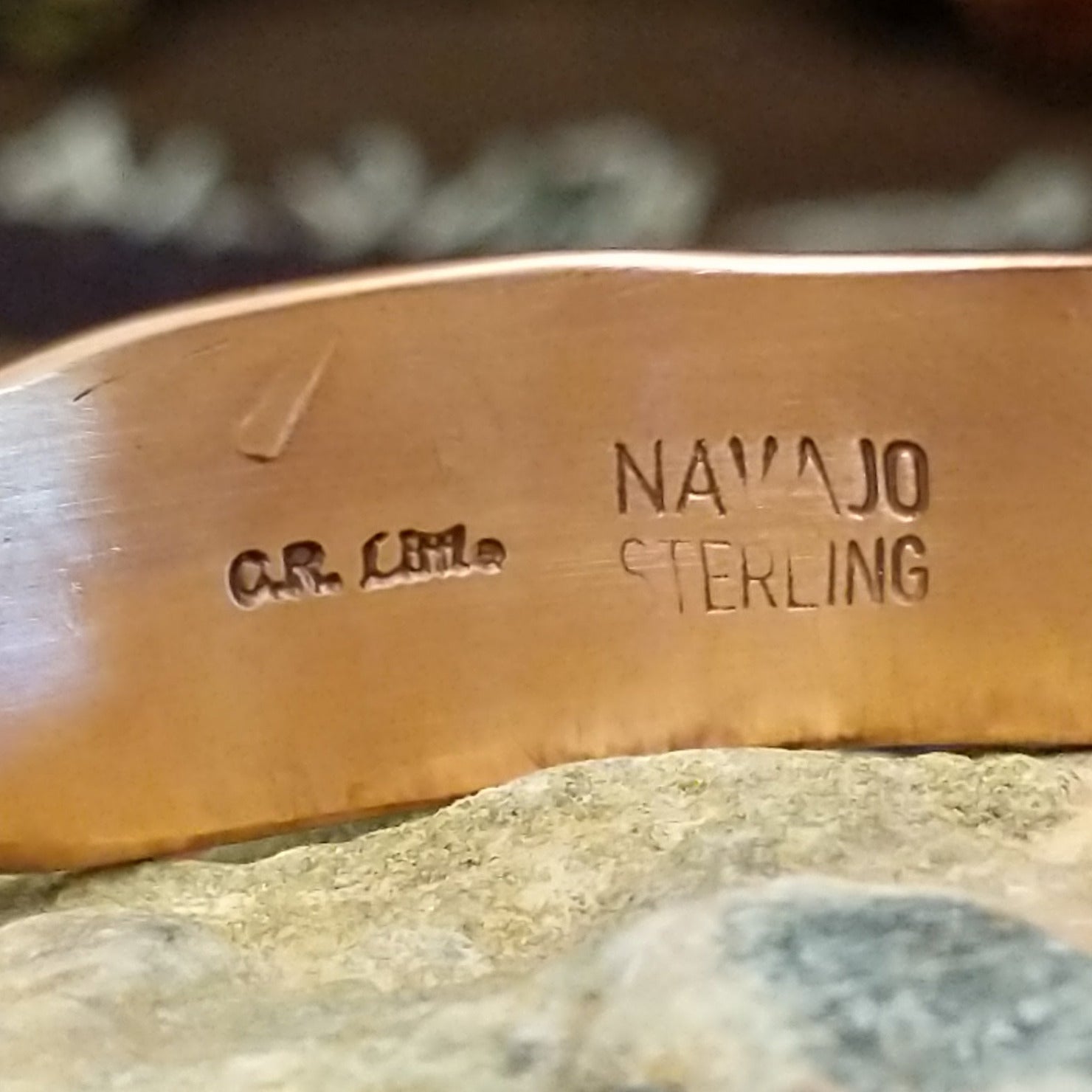 Handcrafted copper and sterling silver cuff bracelet by Navajo artisan Robert Little featuring fan-stamped detailing in a traditional Southwestern design. Artisan and Sterling Silver stamp.
