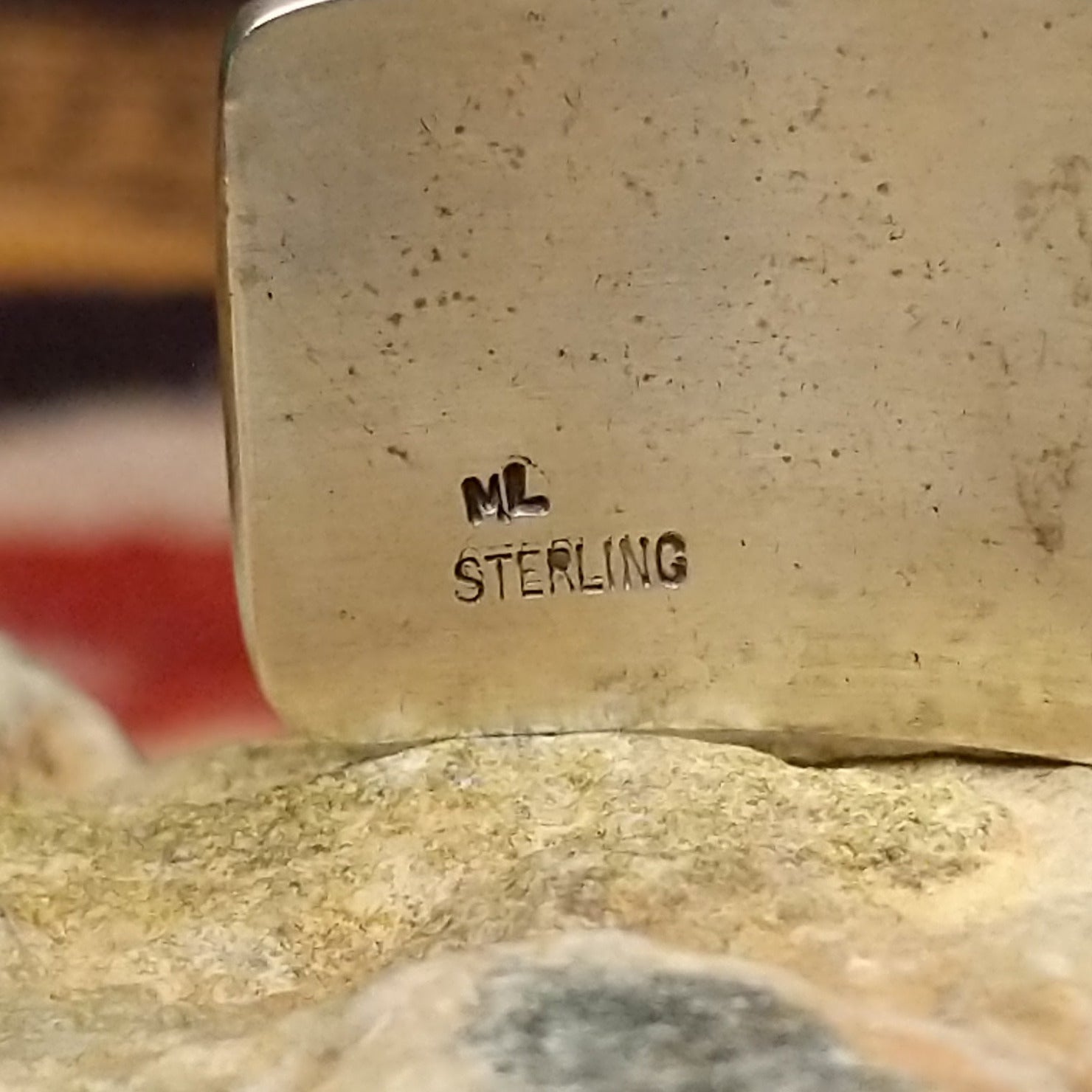 Handcrafted sterling silver cuff bracelet by Hopi artist Melinda Lucas featuring a carved Kokopelli design in a traditional Southwestern style. Artisan and Sterling Silver stamp.