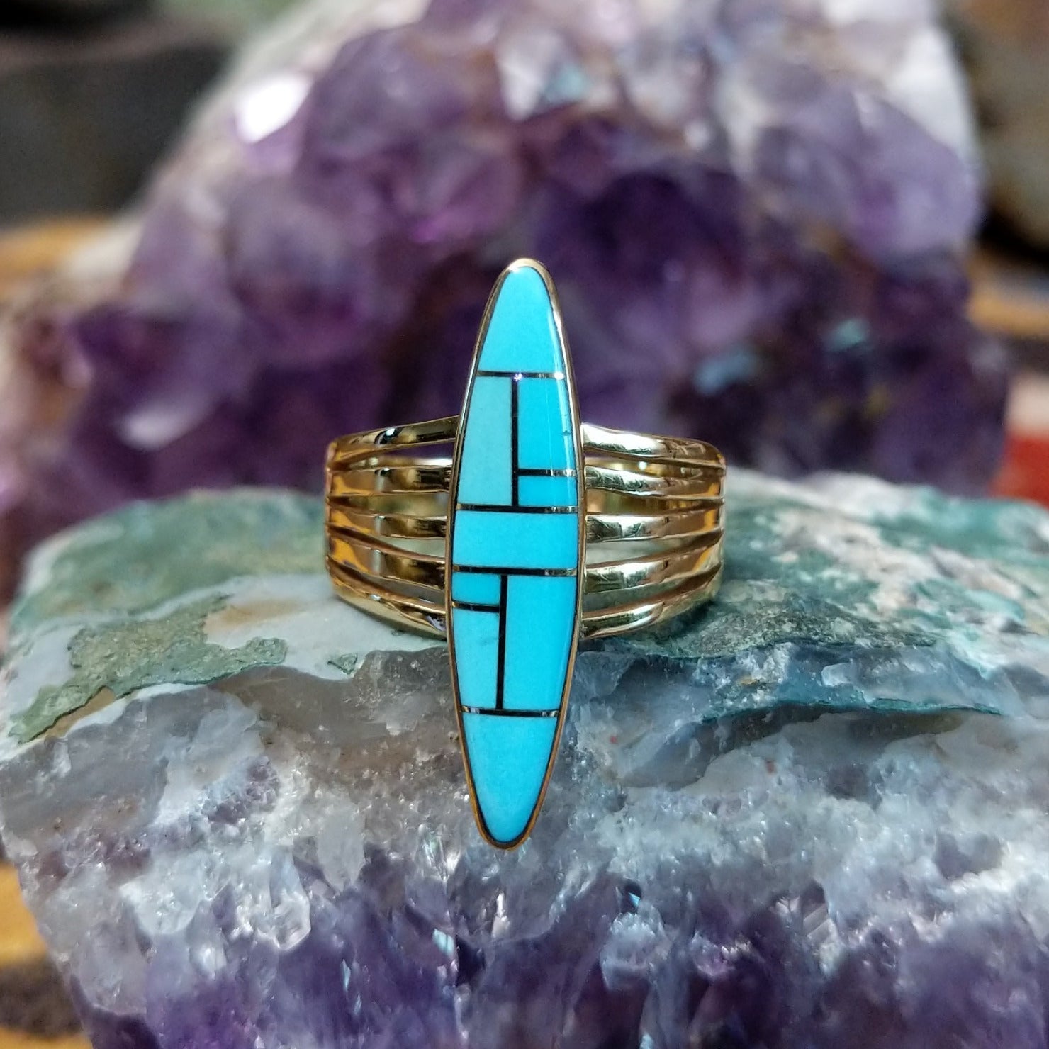 Handcrafted 14K gold navette ring by R.D. featuring vibrant turquoise inlay in a traditional Southwestern Native American design.
