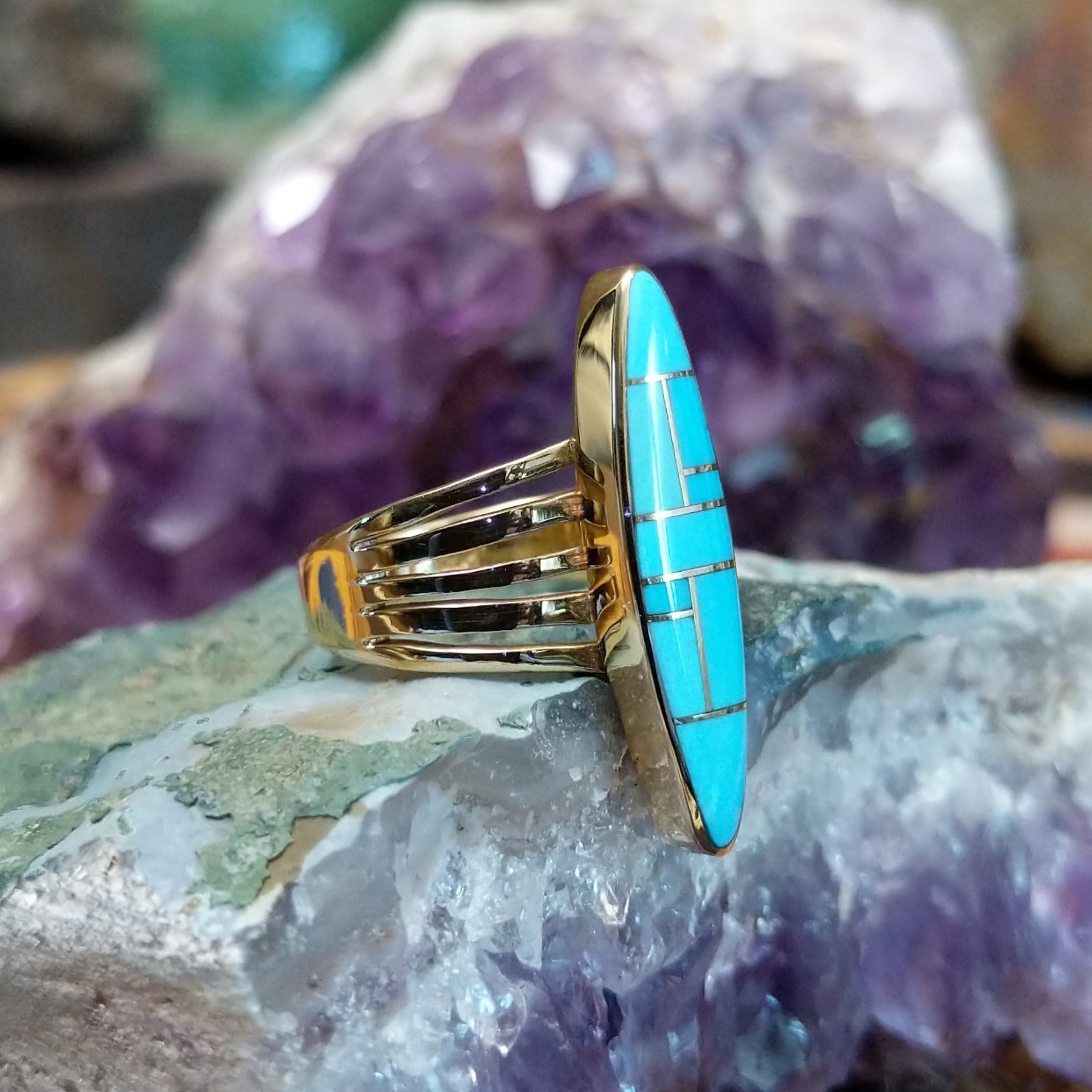 Handcrafted 14K gold navette ring by R.D. featuring vibrant turquoise inlay in a traditional Southwestern Native American design. Side view.