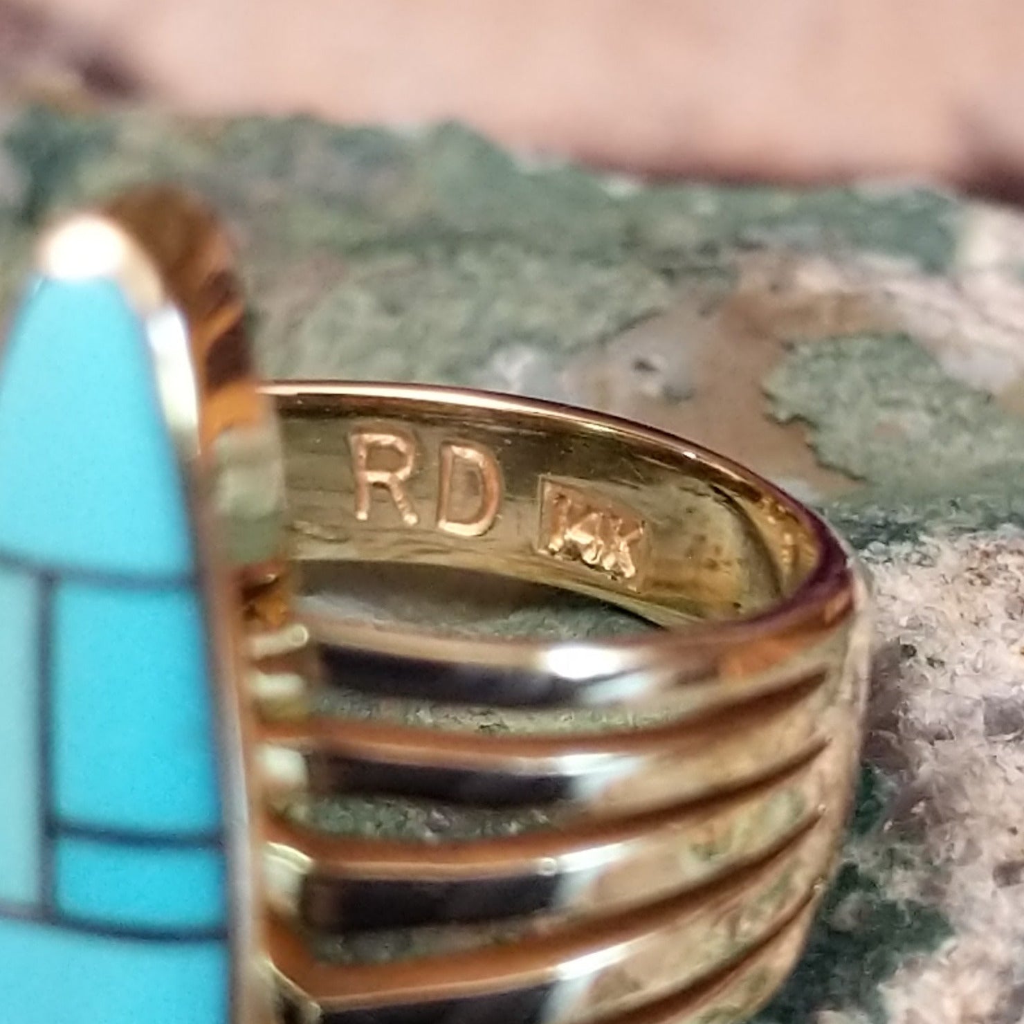 Handcrafted 14K gold navette ring by R.D. featuring vibrant turquoise inlay in a traditional Southwestern Native American design. Artisan and 14K gold stamp.