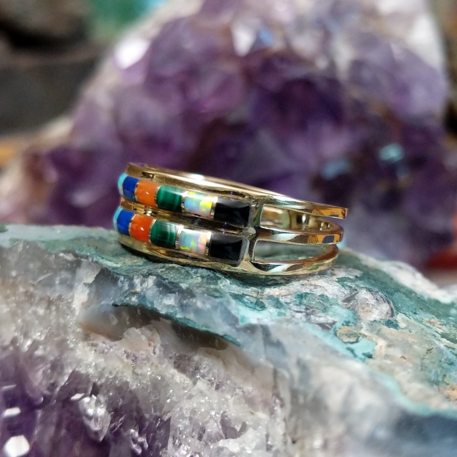 Two row multistone inlay ring in 14K yellow gold by Tom Billy, featuring colorful stone inlay arranged in parallel rows within a polished gold band. Side view.