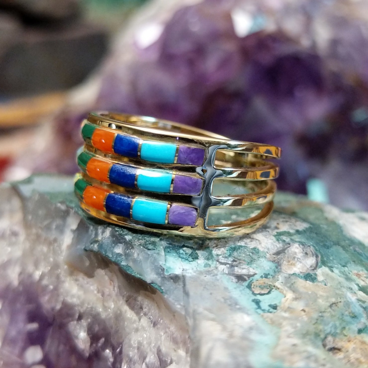Three row multistone inlay ring in 14K yellow gold by Tom Billy, featuring colorful stone inlay arranged in three parallel rows within a polished gold band. Side view.