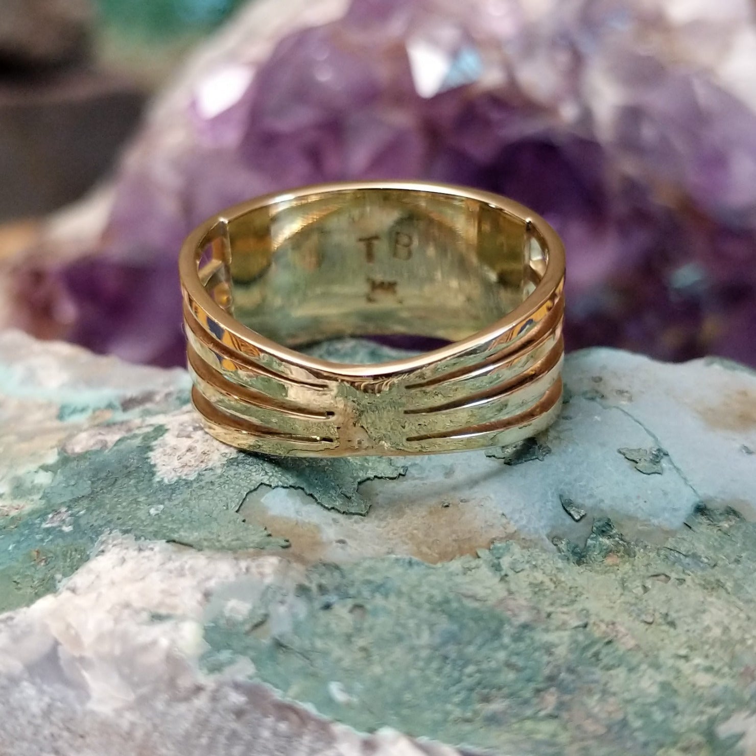 Three row multistone inlay ring in 14K yellow gold by Tom Billy, featuring colorful stone inlay arranged in three parallel rows within a polished gold band. Underside view.