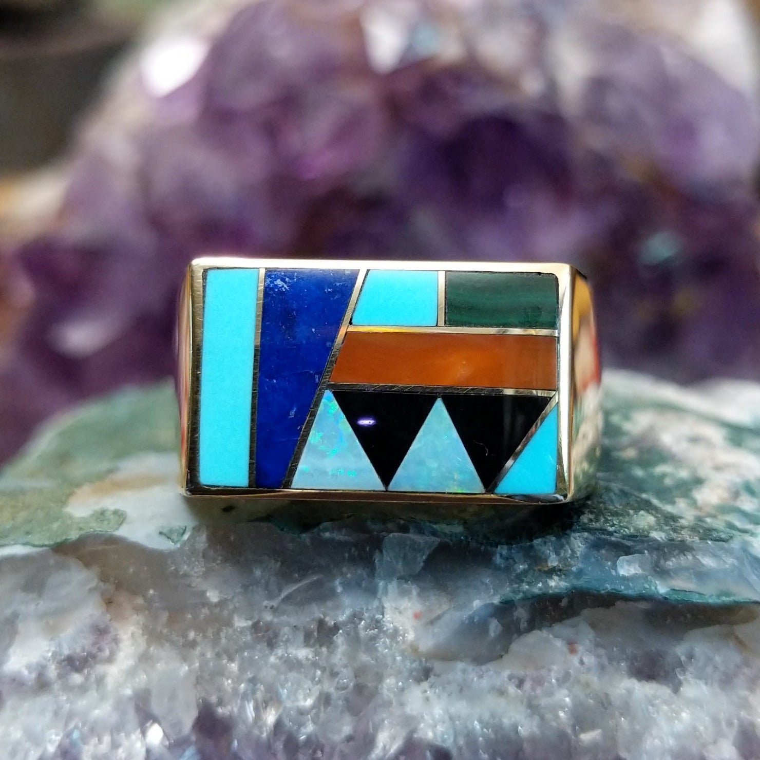 Multistone inlay ring in 14K yellow gold by Steve Francisco, featuring colorful stone inlay patterns set within a polished gold band.