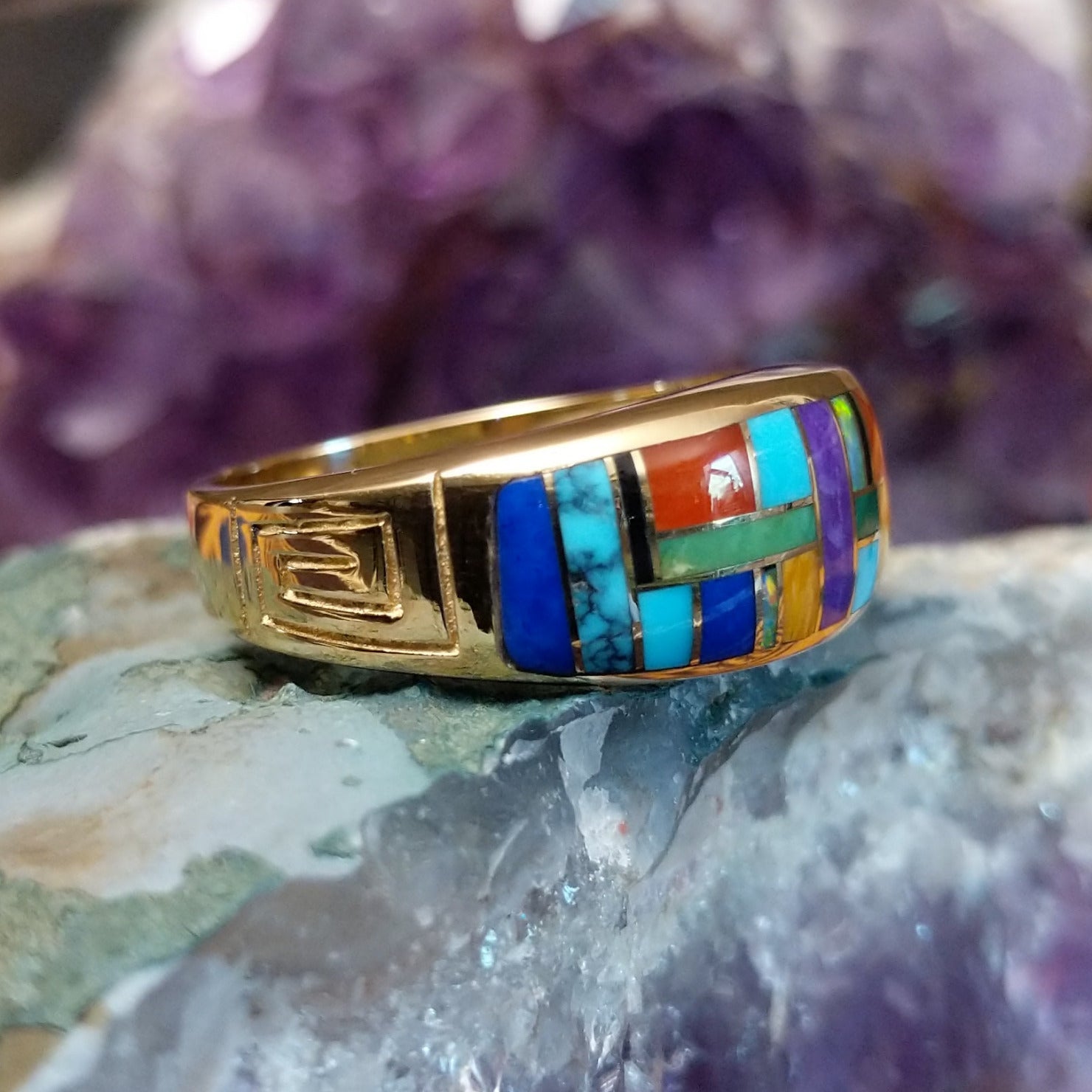Navajo multistone mosaic inlay ring in 14K yellow gold, featuring a colorful arrangement of individually fitted stones set within a polished gold band. Side view.