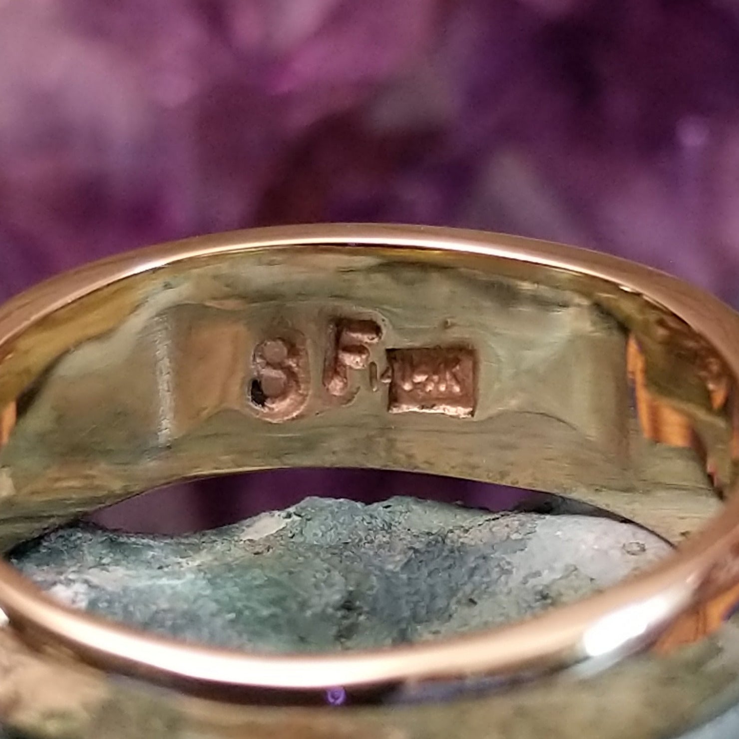 Multistone tiled inlay ring in 14K yellow gold by Steve Francisco, featuring a structured mosaic of individually cut stones set within a polished gold band. Artisan and 14K gold stamp.