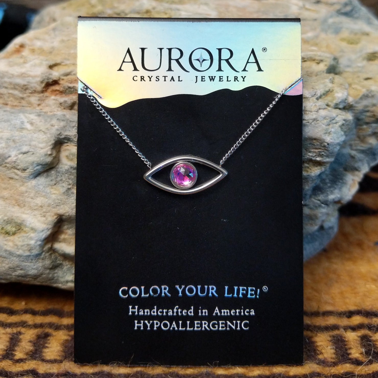 Aurora Eye necklace by LeightWorks, featuring a sparkling crystal pendant with faceted details with an eye shaped design.
