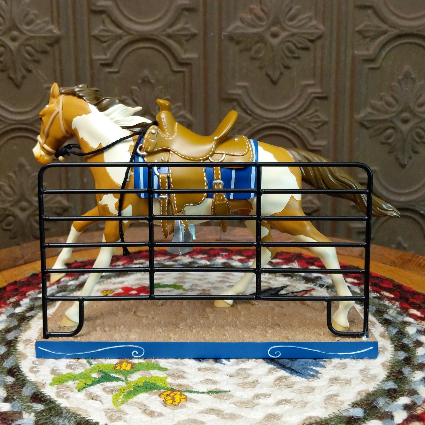 "The Foreman" collectible pony by The Trail of Painted Ponies, featuring detailed hand-painted Western-inspired artwork and ranching-themed design elements.