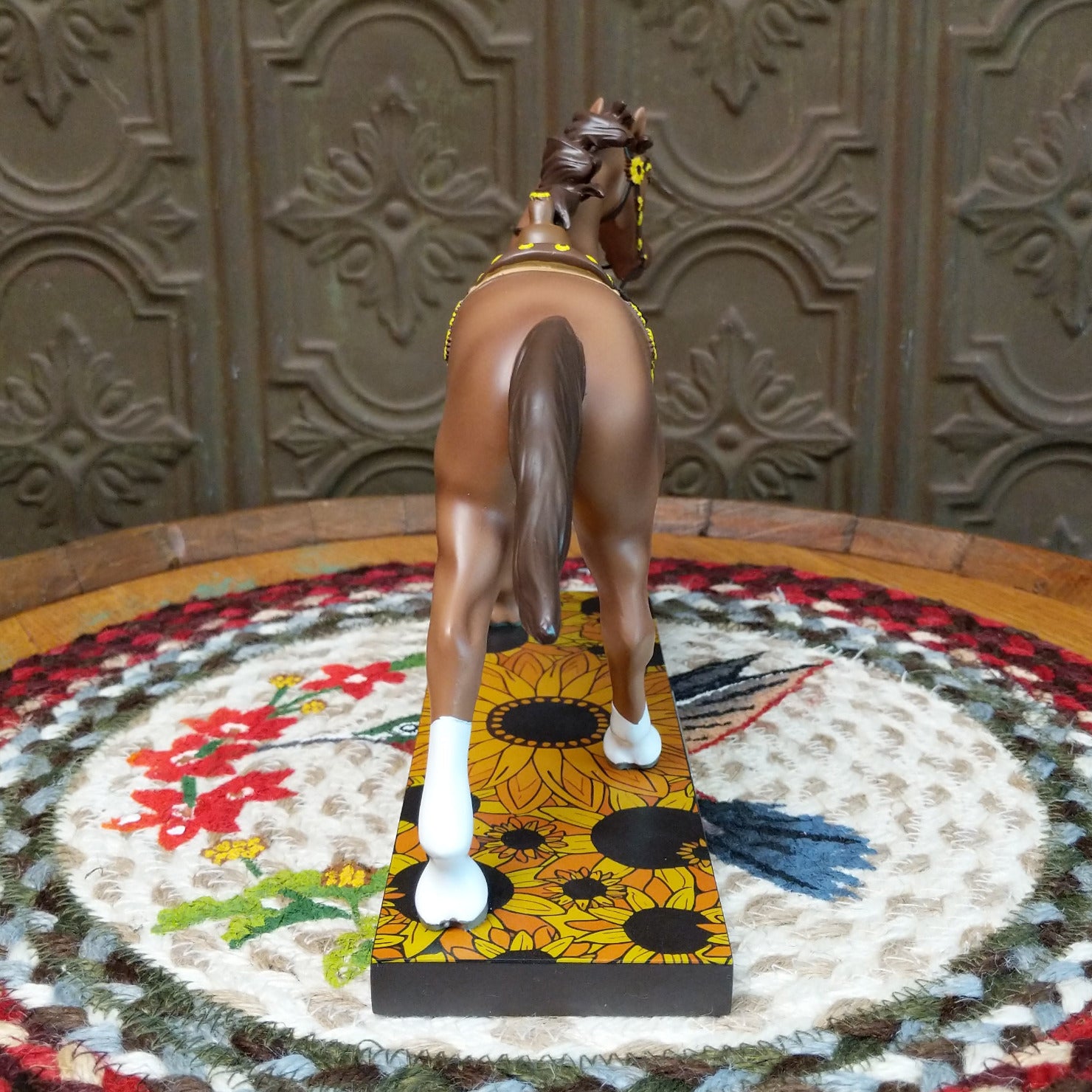 "Sunflower Sorrel" collectible pony by The Trail of Painted Ponies, featuring detailed hand-painted sunflower artwork, golden tones, and countryside-inspired design elements. Rear view.