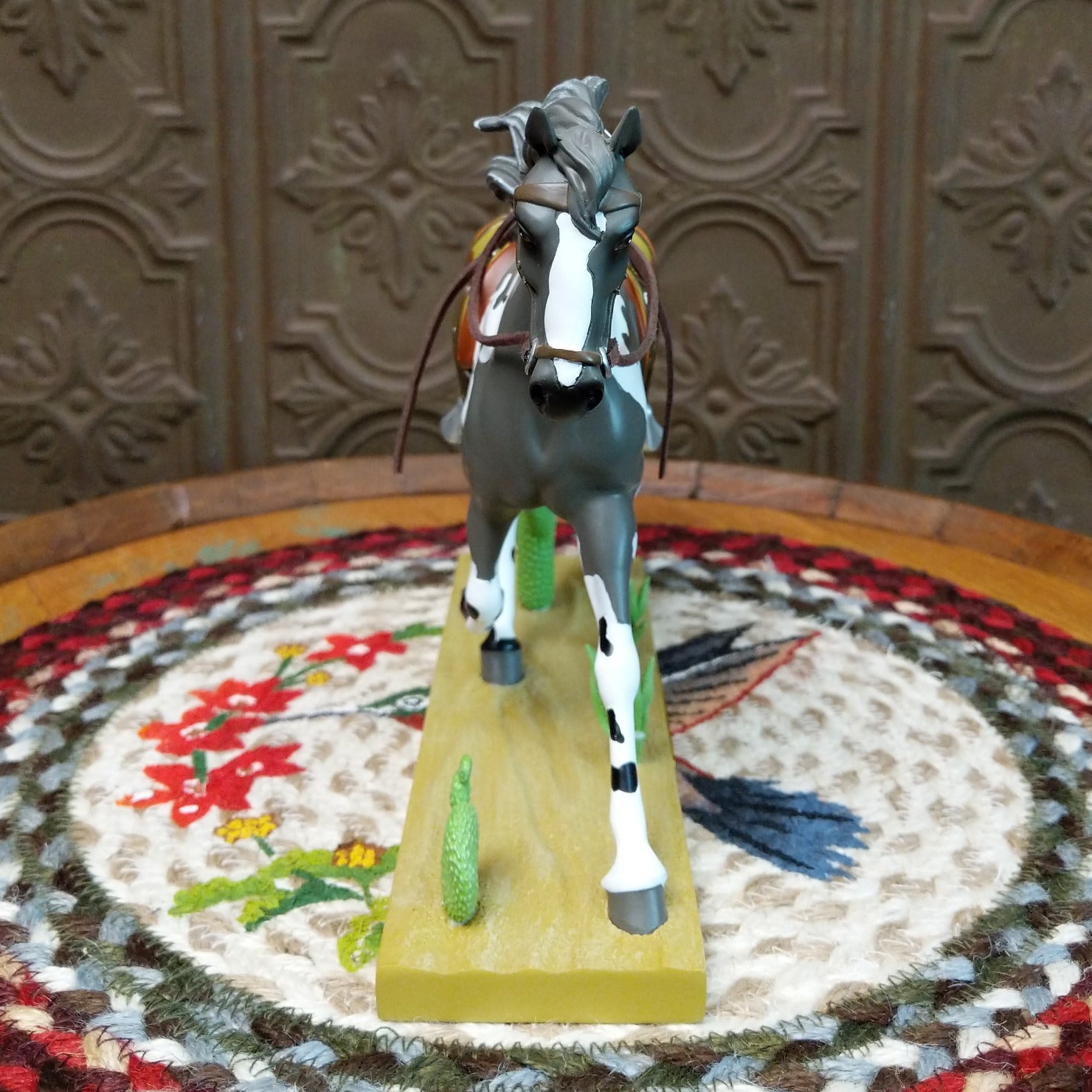 "Desert Buckaroo" collectible pony by The Trail of Painted Ponies, featuring detailed hand-painted desert-inspired artwork, Western themes, and vibrant colors. Front view.